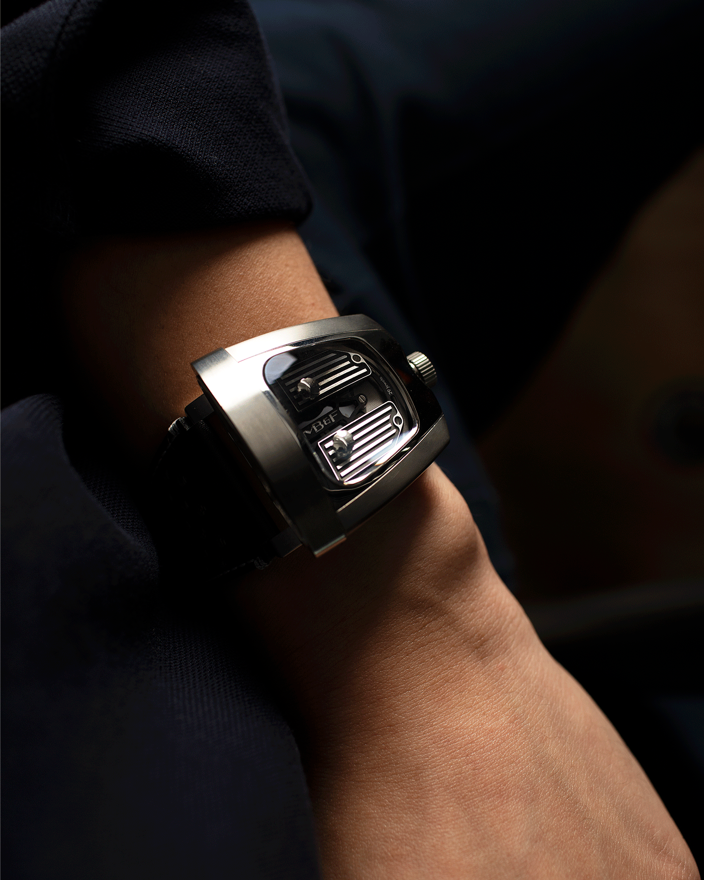 Brand: MB&F Year: 2018 Model: HMX Black Lotus 10th Anniversary Material: Stainless Steel and Titanium Movement: Selitta Based Self Winding Movement Case Diameter: 46.8 x 44.3 x 20.7 mm Bracelet/Strap: MB&F Black Leather Strap and Tang Buckle