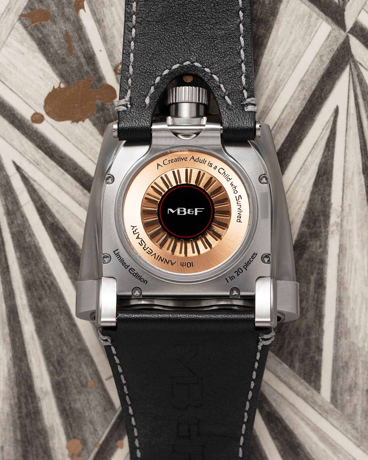 Brand: MB&F Year: 2018 Model: HMX Black Lotus 10th Anniversary Material: Stainless Steel and Titanium Movement: Selitta Based Self Winding Movement Case Diameter: 46.8 x 44.3 x 20.7 mm Bracelet/Strap: MB&F Black Leather Strap and Tang Buckle