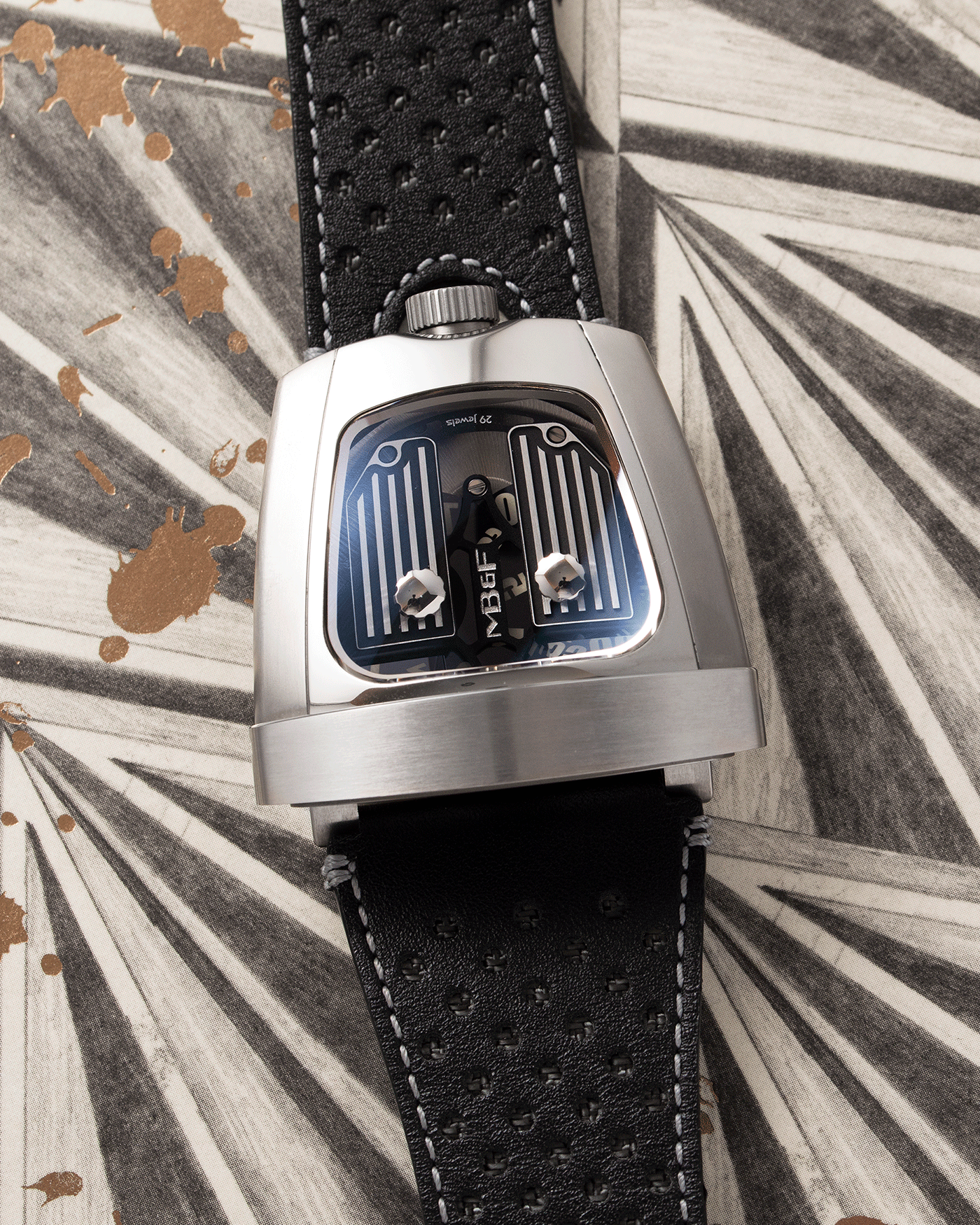 Brand: MB&F Year: 2018 Model: HMX Black Lotus 10th Anniversary Material: Stainless Steel and Titanium Movement: Selitta Based Self Winding Movement Case Diameter: 46.8 x 44.3 x 20.7 mm Bracelet/Strap: MB&F Black Leather Strap and Tang Buckle