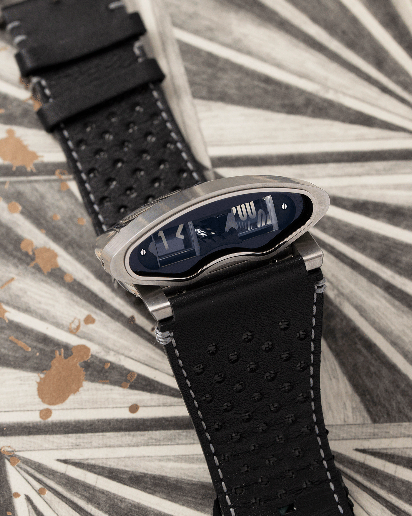 Brand: MB&F Year: 2018 Model: HMX Black Lotus 10th Anniversary Material: Stainless Steel and Titanium Movement: Selitta Based Self Winding Movement Case Diameter: 46.8 x 44.3 x 20.7 mm Bracelet/Strap: MB&F Black Leather Strap and Tang Buckle