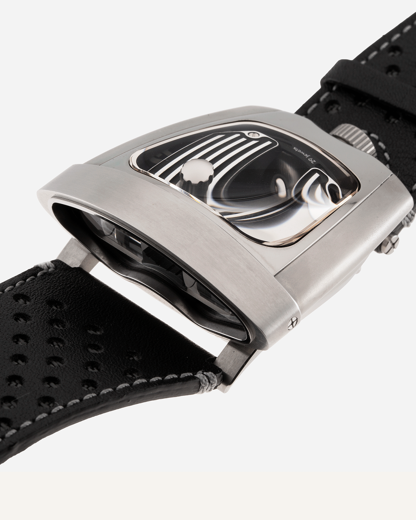 Brand: MB&F Year: 2018 Model: HMX Black Lotus 10th Anniversary Material: Stainless Steel and Titanium Movement: Selitta Based Self Winding Movement Case Diameter: 46.8 x 44.3 x 20.7 mm Bracelet/Strap: MB&F Black Leather Strap and Tang Buckle