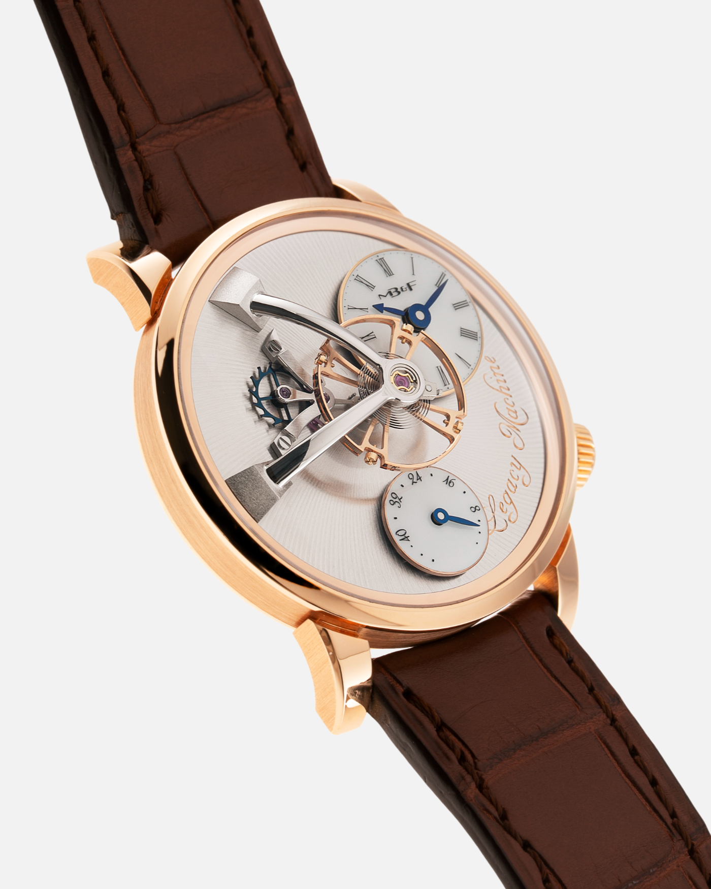 Brand: MB&F Year: 2021 Model: LM101  Material: Rose Gold Movement: In-House MB&F Caliber in collaboration with Kari Voutilainen Case Diameter: 40mm Bracelet/Strap: MB&F Brown Alligator Strap and 18k Rose Gold Tang Buckle