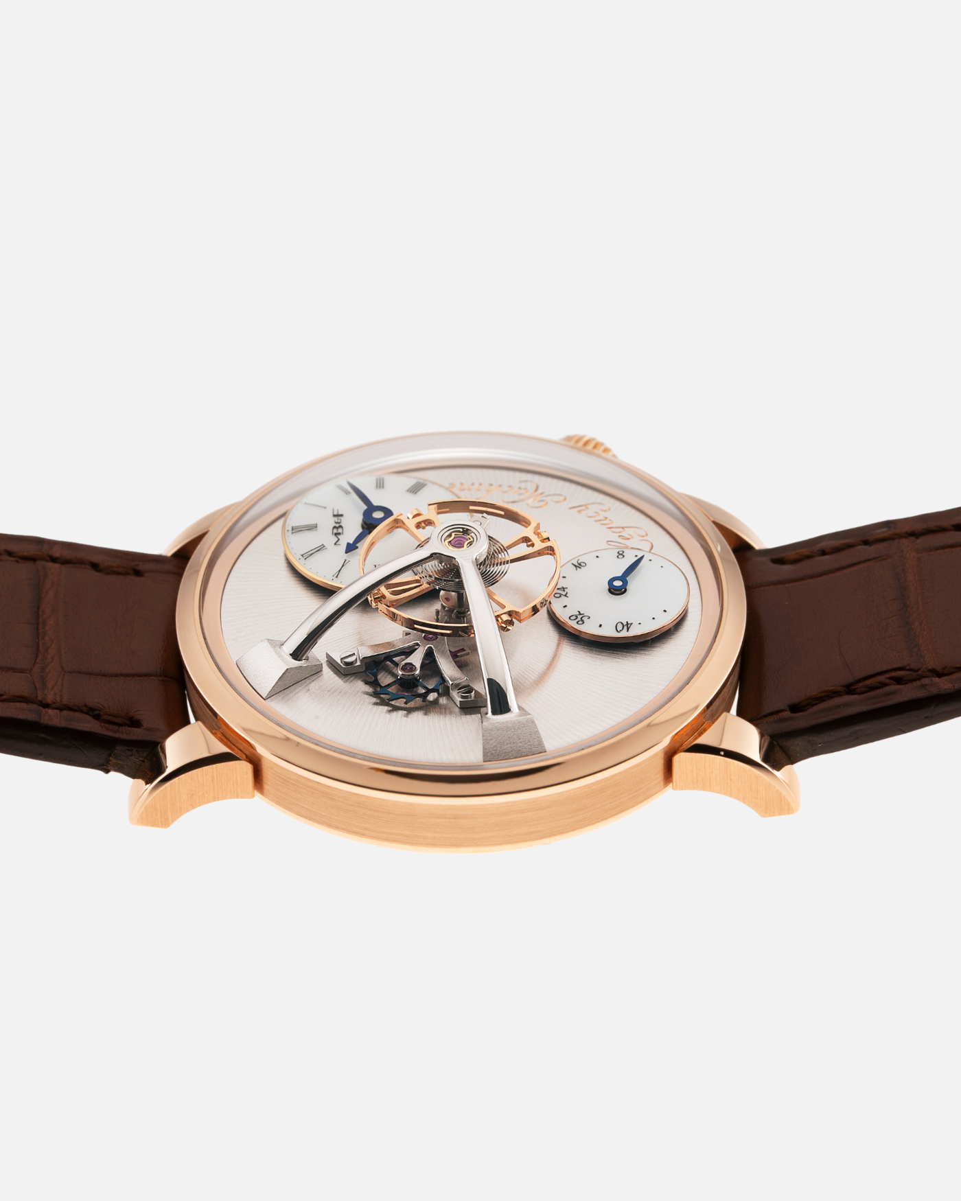 Brand: MB&F Year: 2021 Model: LM101  Material: Rose Gold Movement: In-House MB&F Caliber in collaboration with Kari Voutilainen Case Diameter: 40mm Bracelet/Strap: MB&F Brown Alligator Strap and 18k Rose Gold Tang Buckle