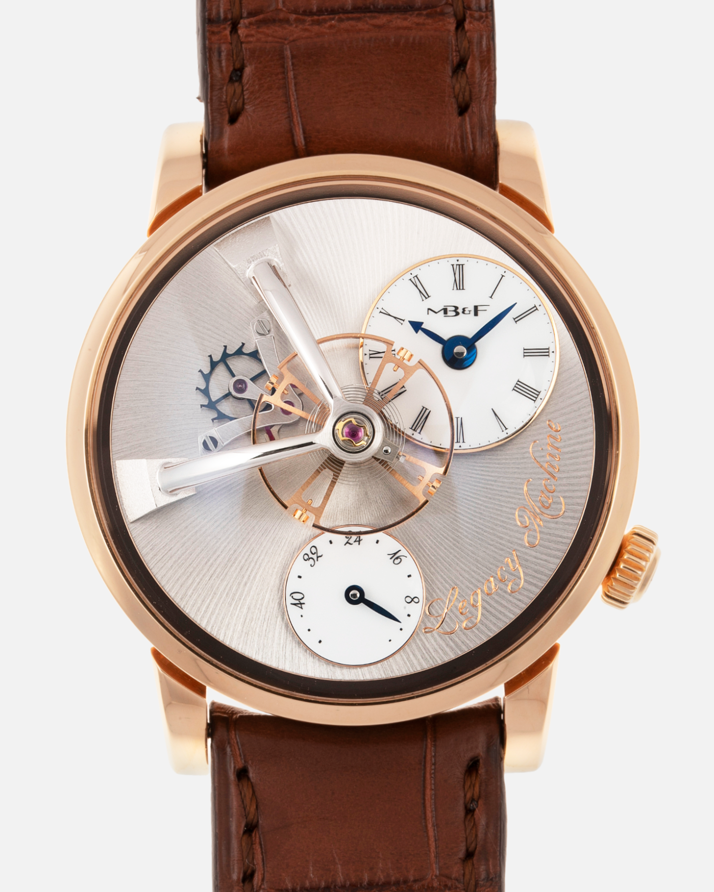 Brand: MB&F Year: 2021 Model: LM101  Material: Rose Gold Movement: In-House MB&F Caliber in collaboration with Kari Voutilainen Case Diameter: 40mm Bracelet/Strap: MB&F Brown Alligator Strap and 18k Rose Gold Tang Buckle