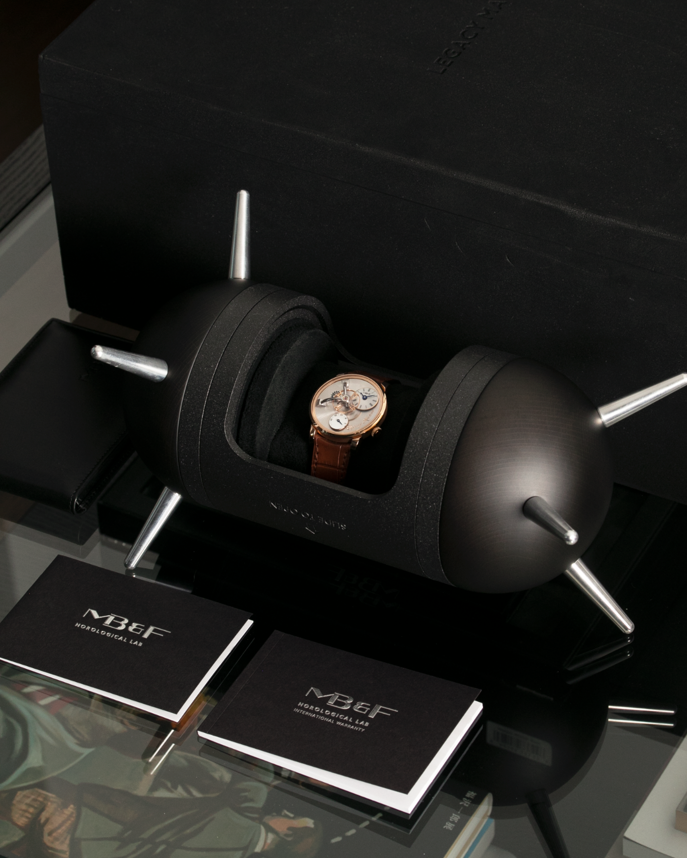 Brand: MB&F Year: 2021 Model: LM101  Material: Rose Gold Movement: In-House MB&F Caliber in collaboration with Kari Voutilainen Case Diameter: 40mm Bracelet/Strap: MB&F Brown Alligator Strap and 18k Rose Gold Tang Buckle