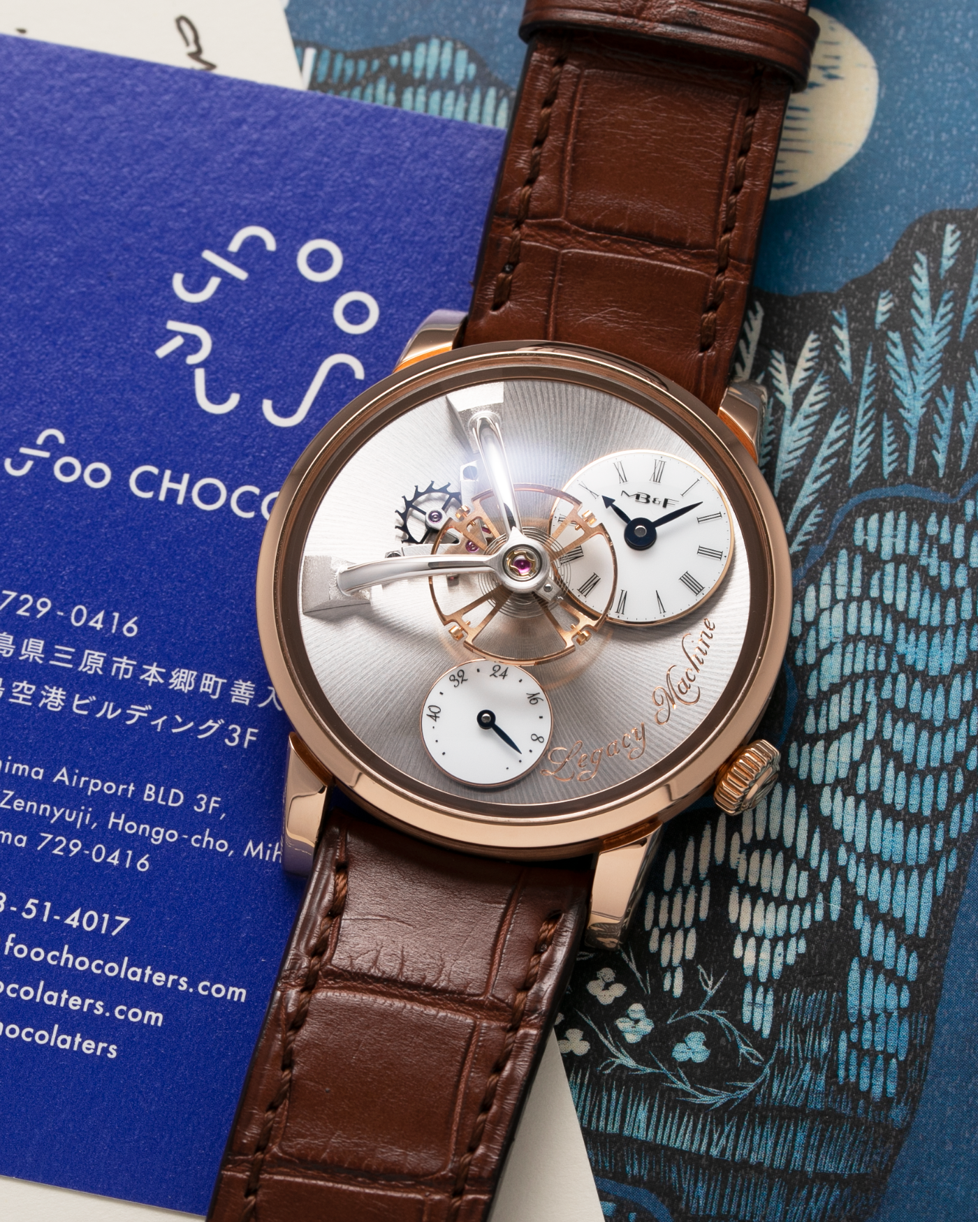 Brand: MB&F Year: 2021 Model: LM101  Material: Rose Gold Movement: In-House MB&F Caliber in collaboration with Kari Voutilainen Case Diameter: 40mm Bracelet/Strap: MB&F Brown Alligator Strap and 18k Rose Gold Tang Buckle