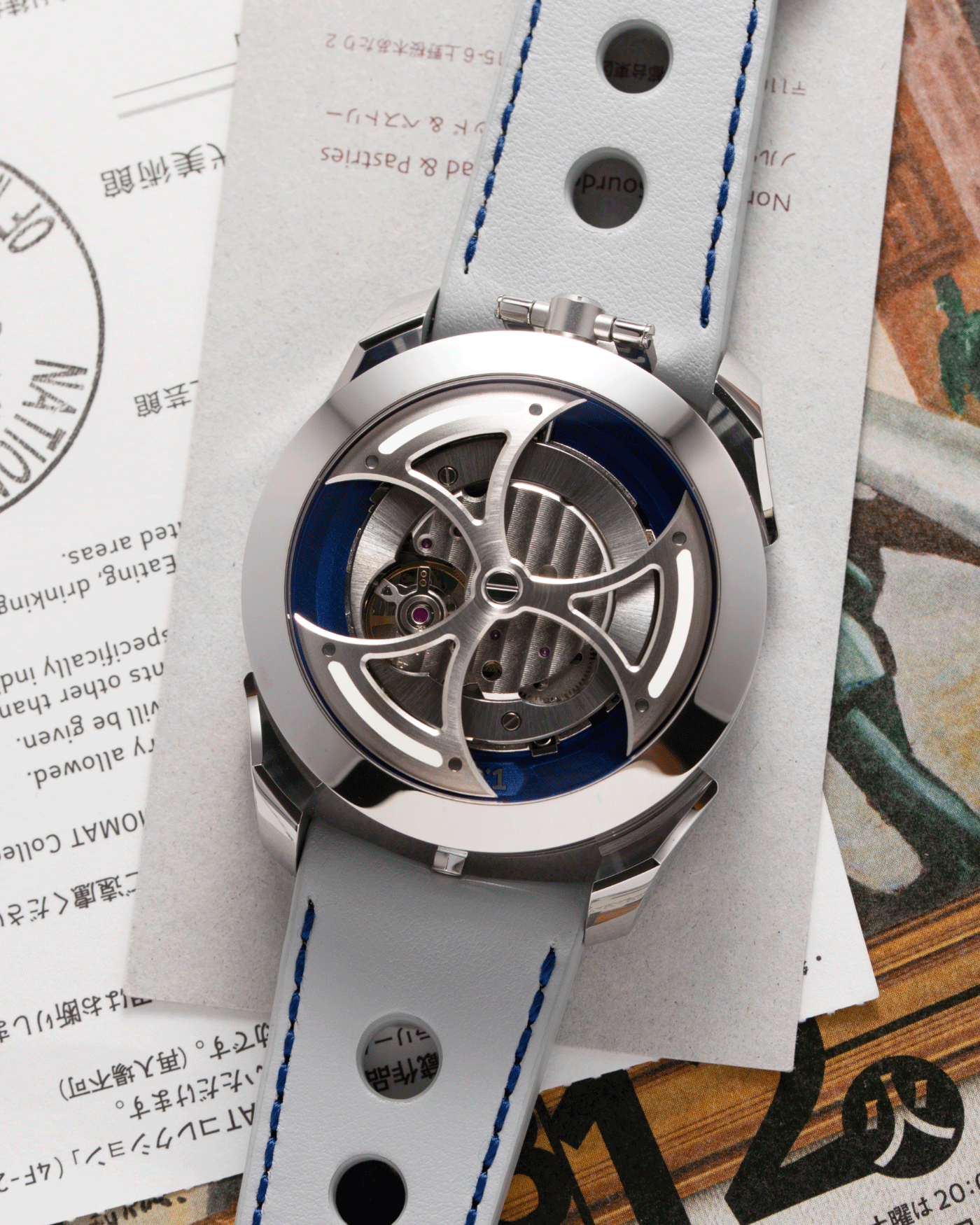 Brand: MB&F Year: 2021 Model: MAD 1 Material: Stainless Steel and Titanium Movement: Miyota Cal 821A Case Diameter: 42mm Bracelet/Strap: MB&F White Grey Leather Rally Strap and Stainless Steel Deployant 