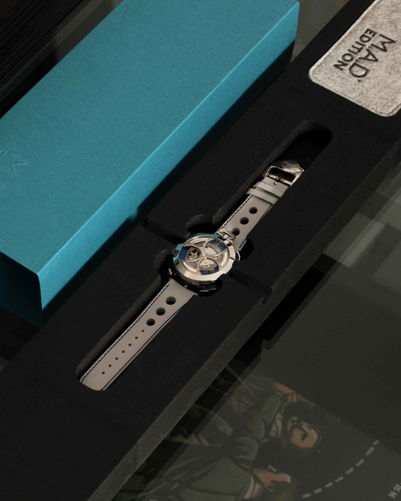 Brand: MB&F Year: 2021 Model: MAD 1 Material: Stainless Steel and Titanium Movement: Miyota Cal 821A Case Diameter: 42mm Bracelet/Strap: MB&F White Grey Leather Rally Strap and Stainless Steel Deployant 