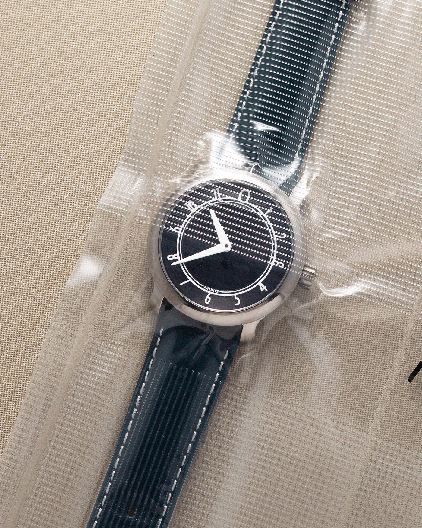 Brand: Ming Year: 2017 Model: 17.01 Material: Grade 5 Titanium Movement: Hand-winding mechanical movement Sellita SW210-1 Case Diameter: 38mm Strap: 3 Unused Ming Calf Straps, Ming Stainless Steel Tang Buckle