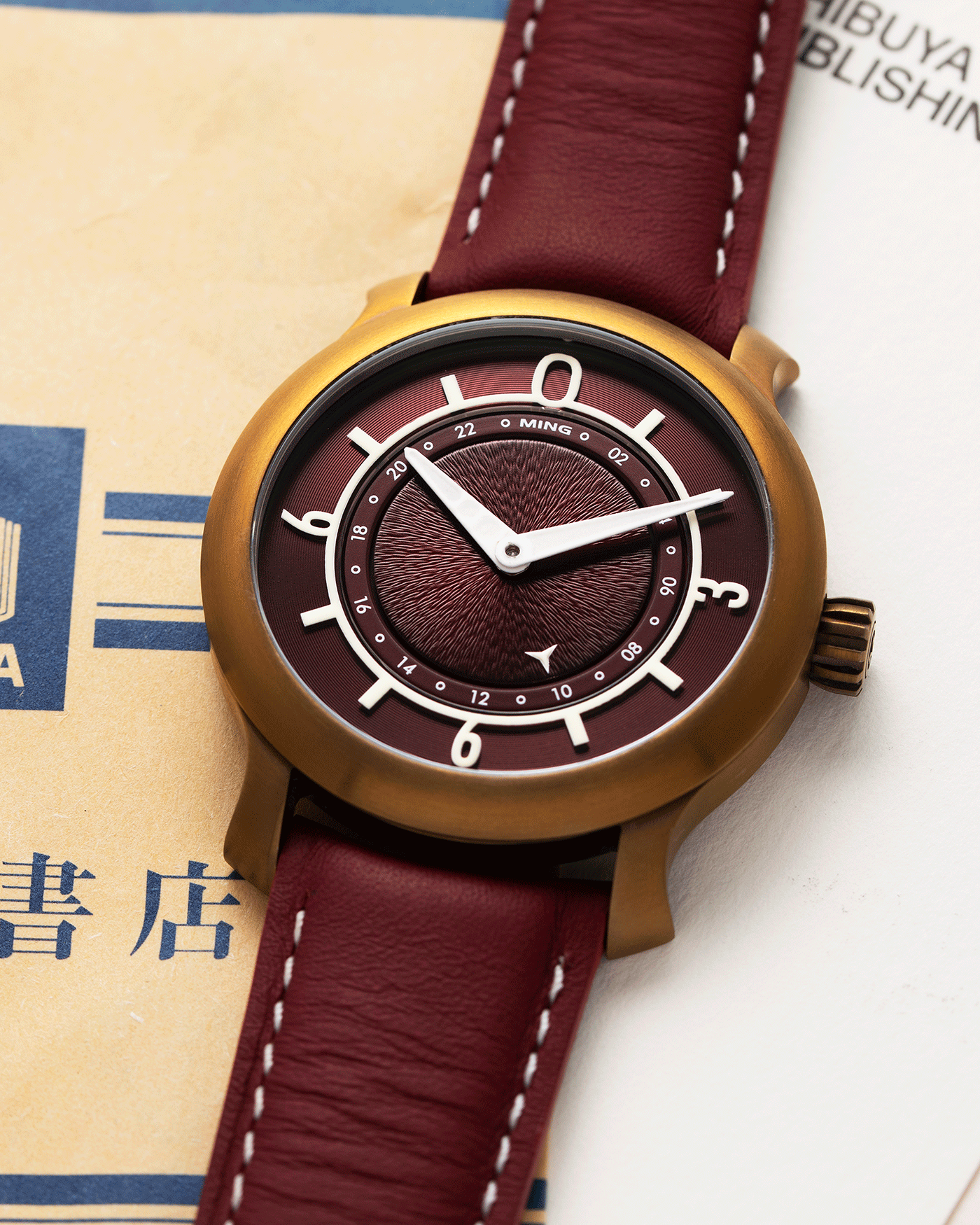 Brand: Ming Year: 2018 Model: 17.03 BB Edition Material: Anodised Grade 2 Titanium Movement: Self-Winding Sellita SW 330-1 Case Diameter: 38mm Strap: Ming Burgundy Smooth Calf by Jean Rousseau Paris and Matching Annodised Grade 2 Titanium Tang Buckle