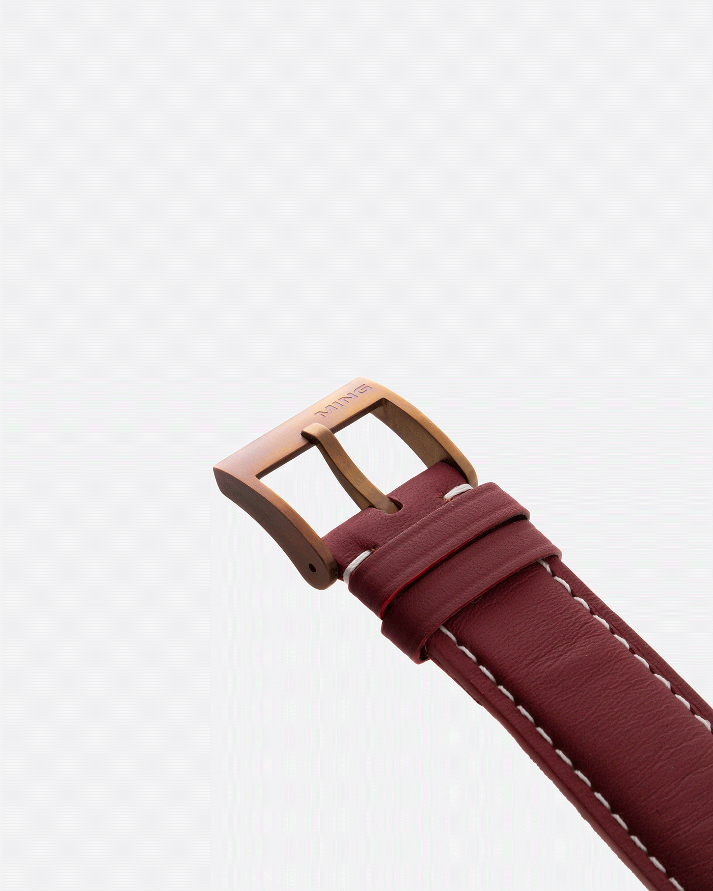Brand: Ming Year: 2018 Model: 17.03 BB Edition Material: Anodised Grade 2 Titanium Movement: Self-Winding Sellita SW 330-1 Case Diameter: 38mm Strap: Ming Burgundy Smooth Calf by Jean Rousseau Paris and Matching Annodised Grade 2 Titanium Tang Buckle