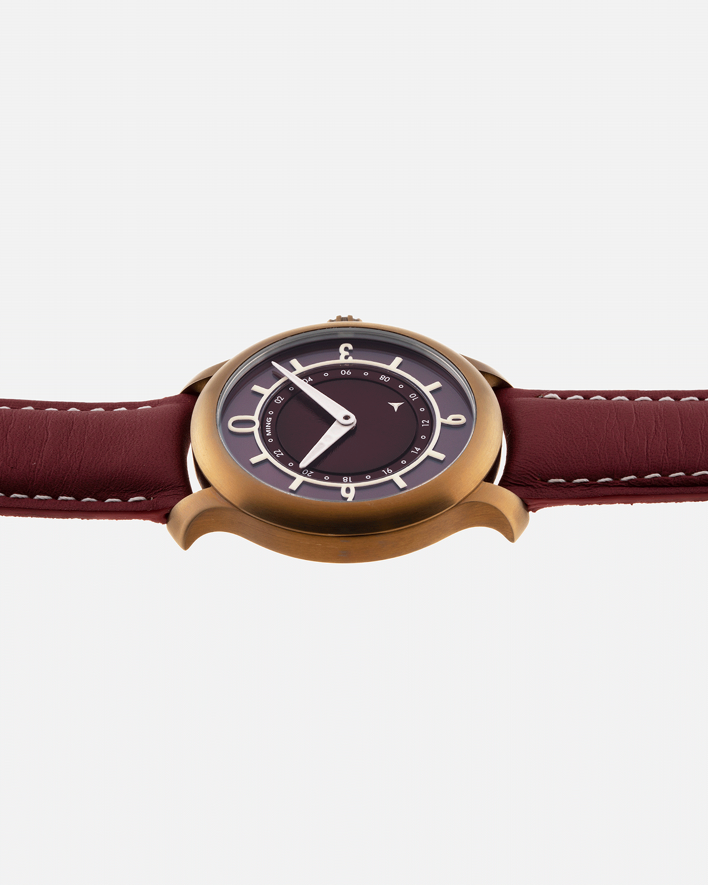 Brand: Ming Year: 2018 Model: 17.03 BB Edition Material: Anodised Grade 2 Titanium Movement: Self-Winding Sellita SW 330-1 Case Diameter: 38mm Strap: Ming Burgundy Smooth Calf by Jean Rousseau Paris and Matching Annodised Grade 2 Titanium Tang Buckle