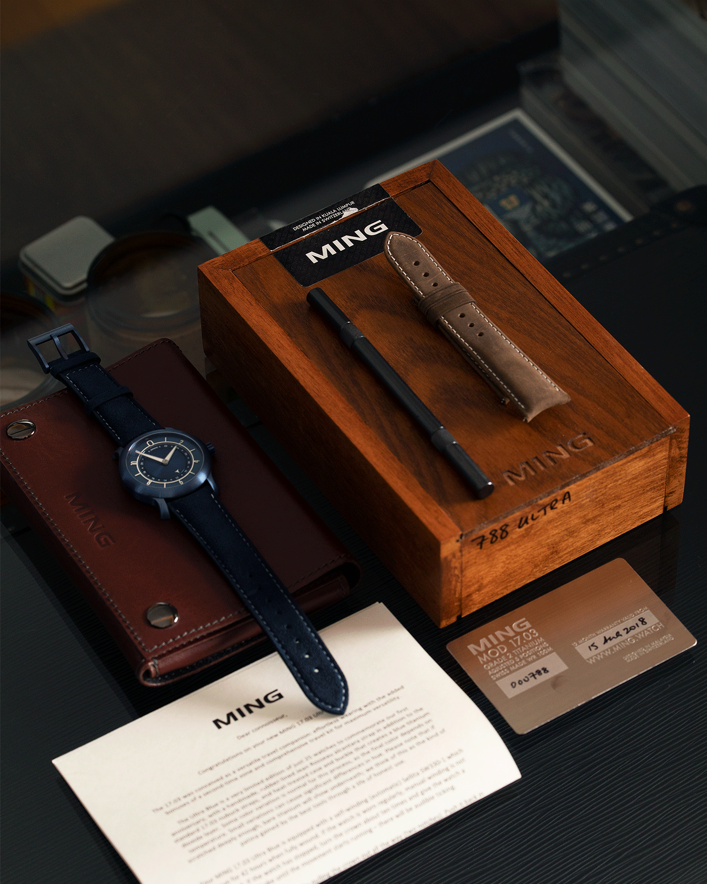 Brand: Ming Year: 2018 Model: 17.03 Material: Grade 2 Titanium Movement: Self-Winding Sellita SW 330-1 Case Diameter: 38mm Strap: Ming Blue Suede Strap and Grade 5 Ultra Blue Titanium Tang Buckle
