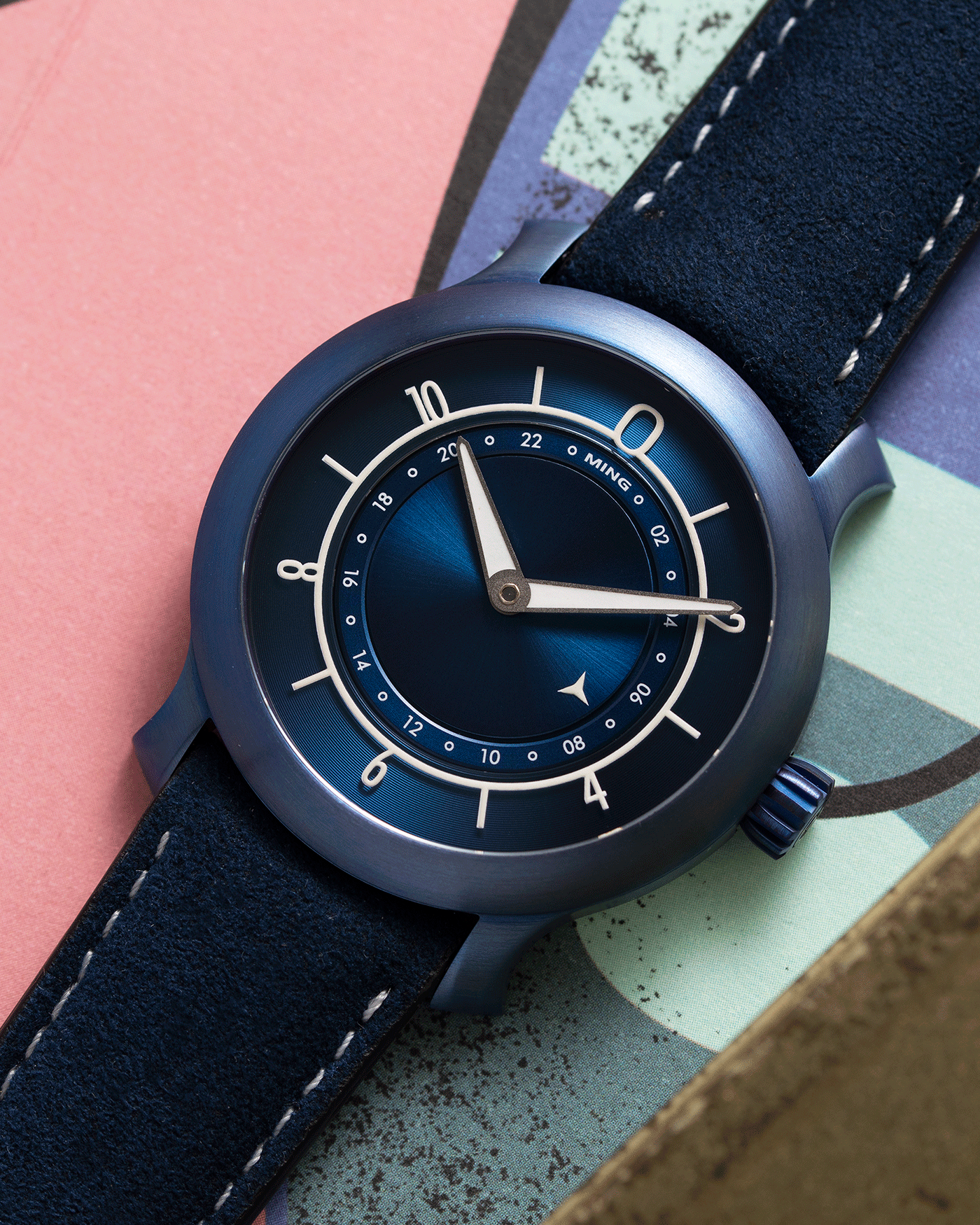 Brand: Ming Year: 2018 Model: 17.03 Material: Grade 2 Titanium Movement: Self-Winding Sellita SW 330-1 Case Diameter: 38mm Strap: Ming Blue Suede Strap and Grade 5 Ultra Blue Titanium Tang Buckle