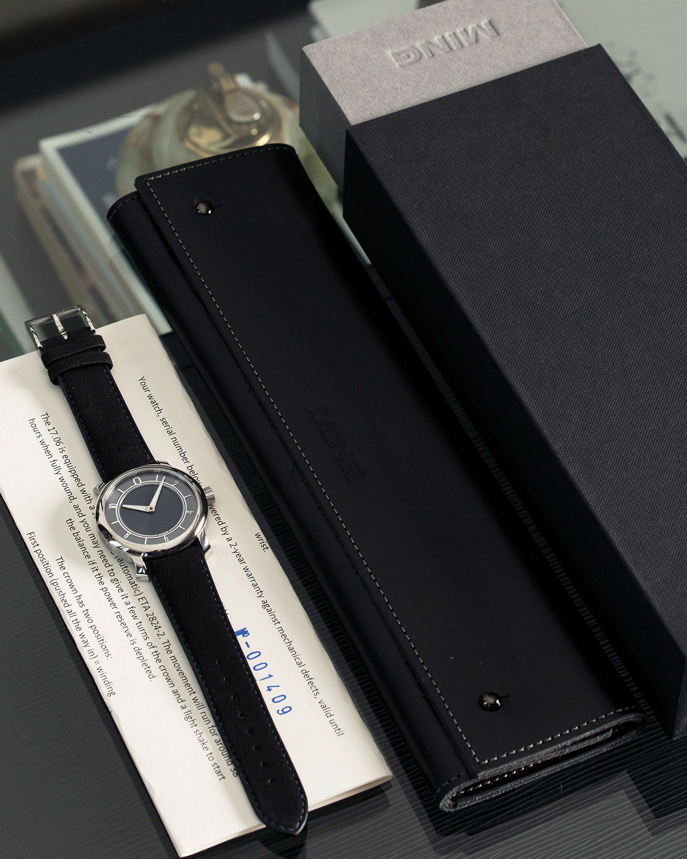 Brand: Ming Year: 2019 Model: 17.06 Material: Stainless Steel Movement: Heavily Modified ETA 2824-2 Case Diameter: 38mm Strap: Jean Rousseau Black Suede with Blue Stitching for MING