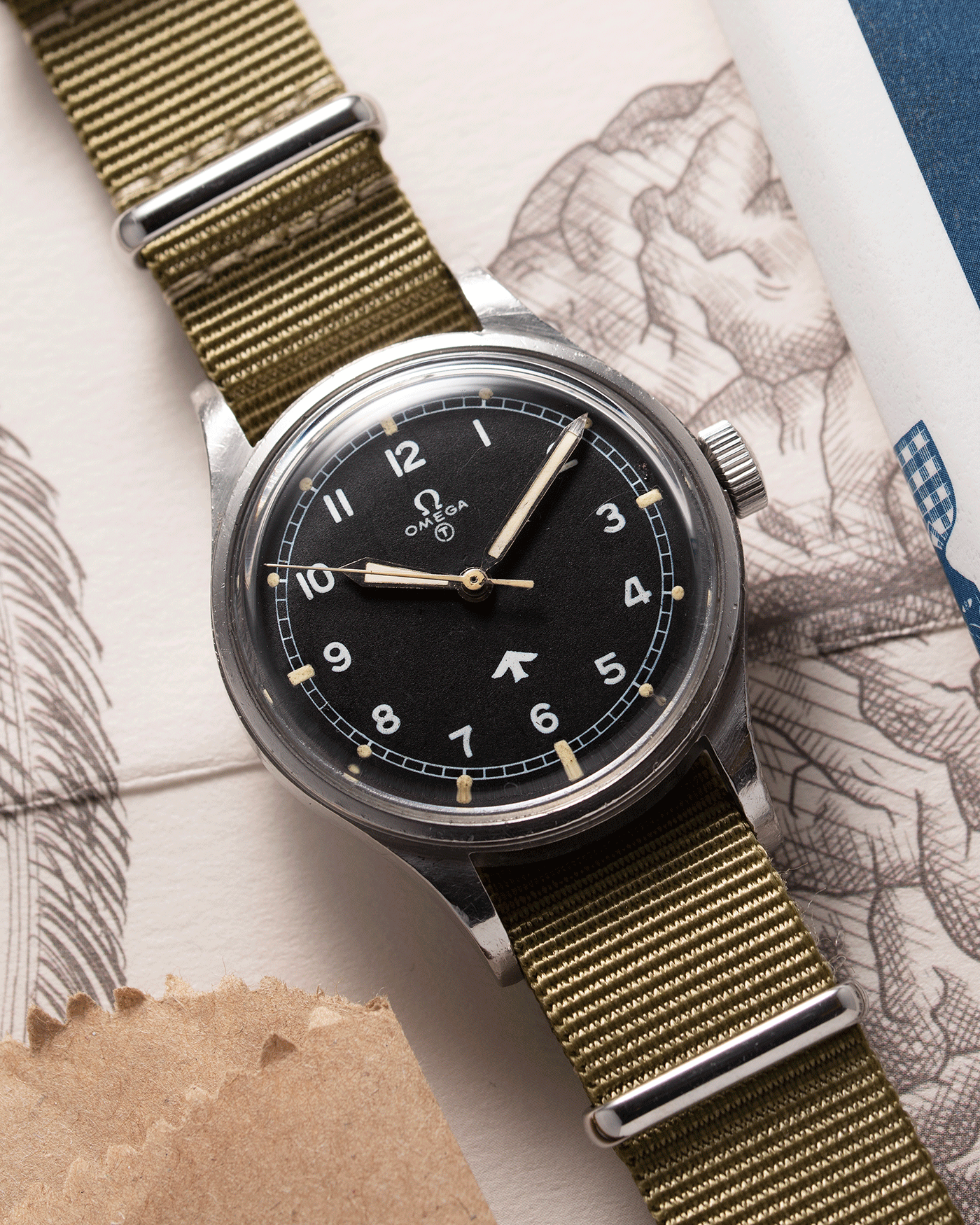 Brand: Omega Year: 1953 Model: Fat Arrow 53 Reference Number: CK 2777-1 Material: Stainless Steel Movement: ‘Specially Adjusted’ Cal. 283 Case Diameter: 37mm Lug Width: 18mm Bracelet/Strap: Green Fabric NATO