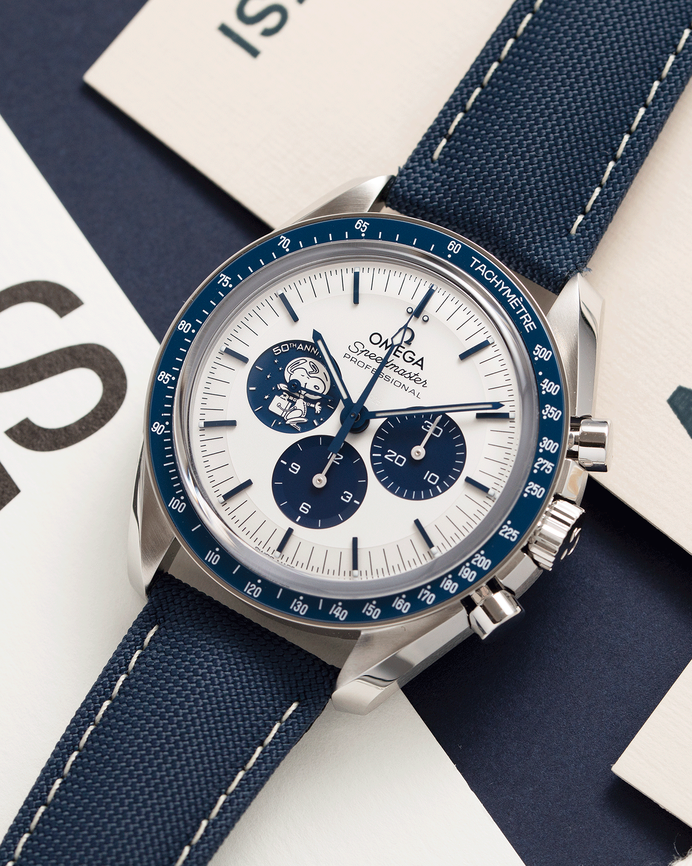 Brand: Omega Year: 2021 Model: Speedmaster Silver Snoopy Award 50th Anniversary Reference Number: 310.32.42.50.02.001 Material: Stainless Steel Movement: Omega in-house Cal. 3861 Case Diameter: 42mm Bracelet/Strap: Omega Blue Coated Nylon Fabric Strap with Omega Stainless Steel Tang Buckle