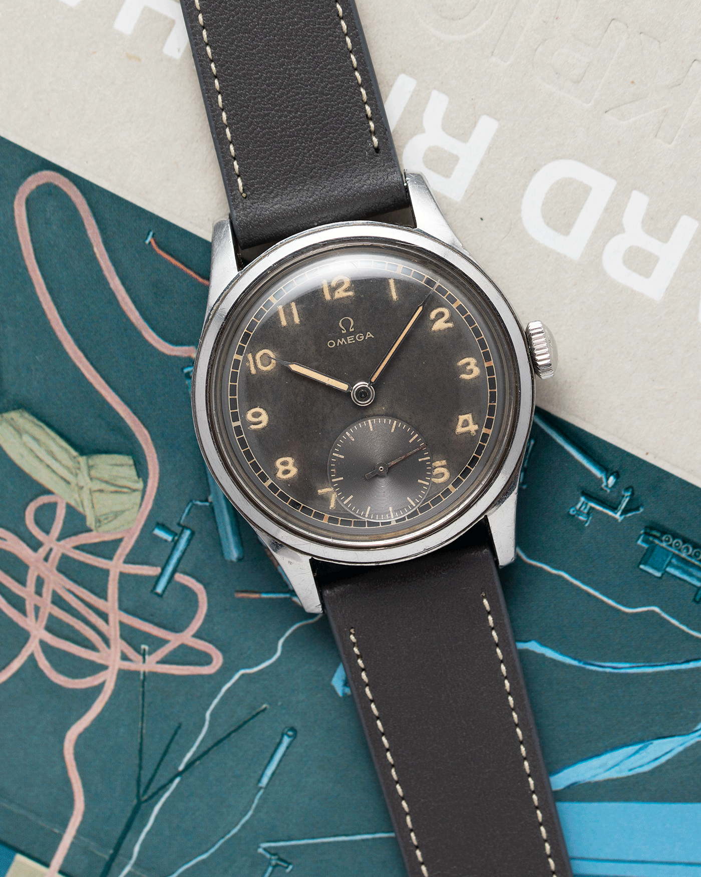 Brand: Omega Year: Approx 1944 Reference Number: 2400-4 Serial Number: 1057XXXX Material: Stainless Steel Movement: Omega 30T2 Case Diameter: 35mm Lug Width: 18mm Bracelet: Nostime Elephant Grey Smooth Calf