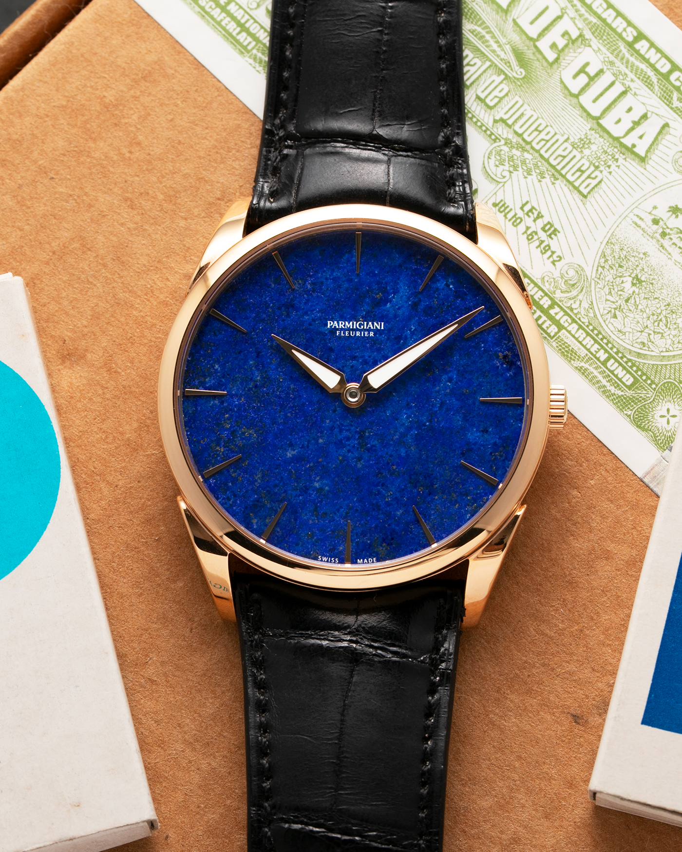 Brand: Parmigiani Fleurier Year: 2022 Model: Tonda 1950 Pisa Edition Lapis Lazuli Material: 18k Rose Gold Movement: In-House PF 701 Micro Rotor Case Diameter: 39mm Strap: Parmigiani Black Alligator with 18k Rose Gold Tang Buckle