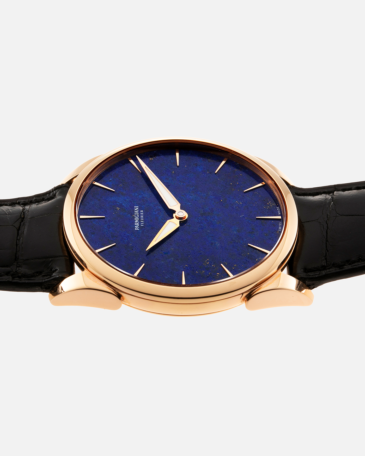 Brand: Parmigiani Fleurier Year: 2022 Model: Tonda 1950 Pisa Edition Lapis Lazuli Material: 18k Rose Gold Movement: In-House PF 701 Micro Rotor Case Diameter: 39mm Strap: Parmigiani Black Alligator with 18k Rose Gold Tang Buckle