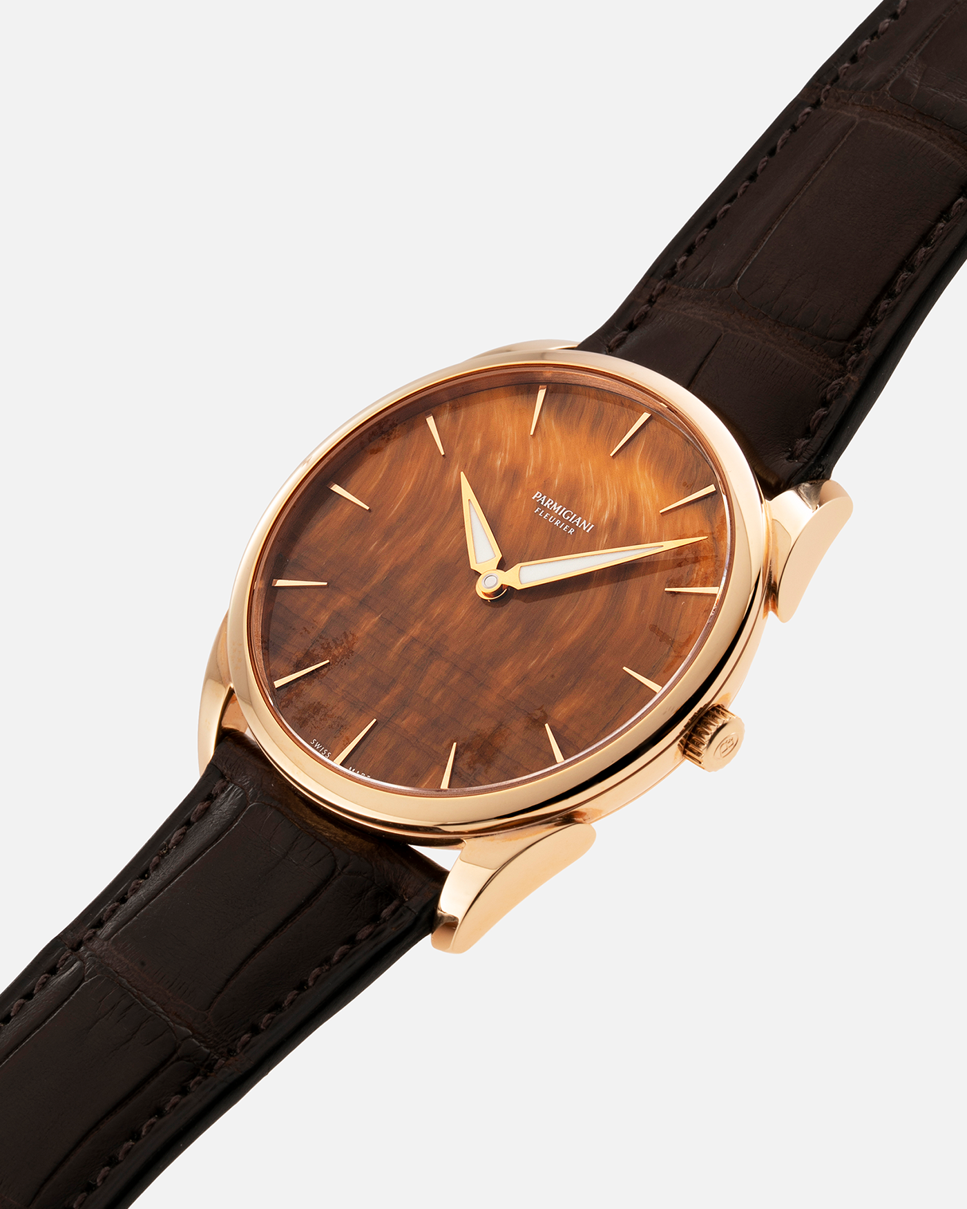 Brand: Parmigiani Fleurier Year: 2022 Model: Tonda 1950 Pisa Edition Tiger Eye Material: 18k Rose Gold Movement: In-House PF 701 Micro Rotor Case Diameter: 39mm Strap: Parmigiani Dark Brown Alligator with 18k Rose Gold Tang Buckle