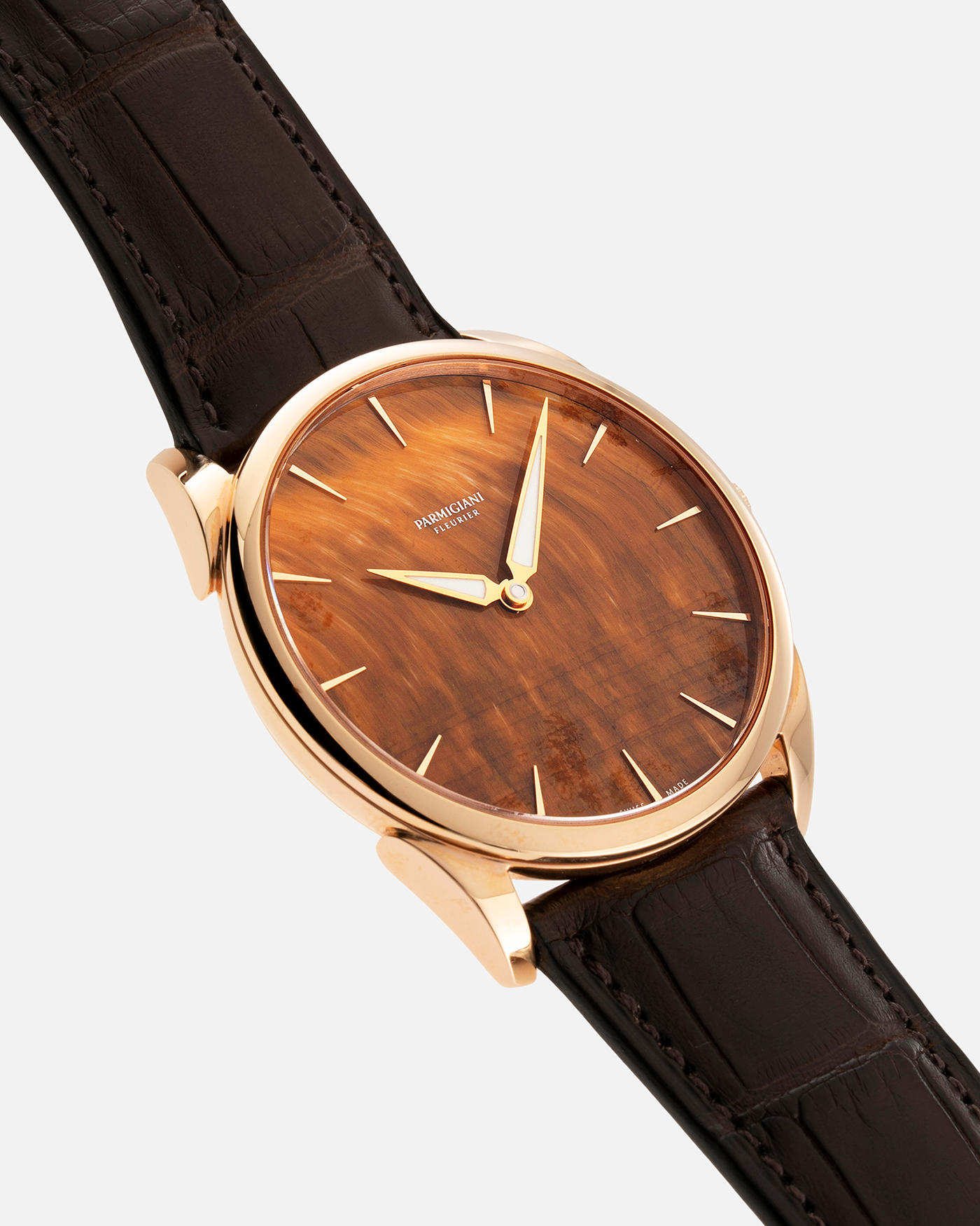 Brand: Parmigiani Fleurier Year: 2022 Model: Tonda 1950 Pisa Edition Tiger Eye Material: 18k Rose Gold Movement: In-House PF 701 Micro Rotor Case Diameter: 39mm Strap: Parmigiani Dark Brown Alligator with 18k Rose Gold Tang Buckle