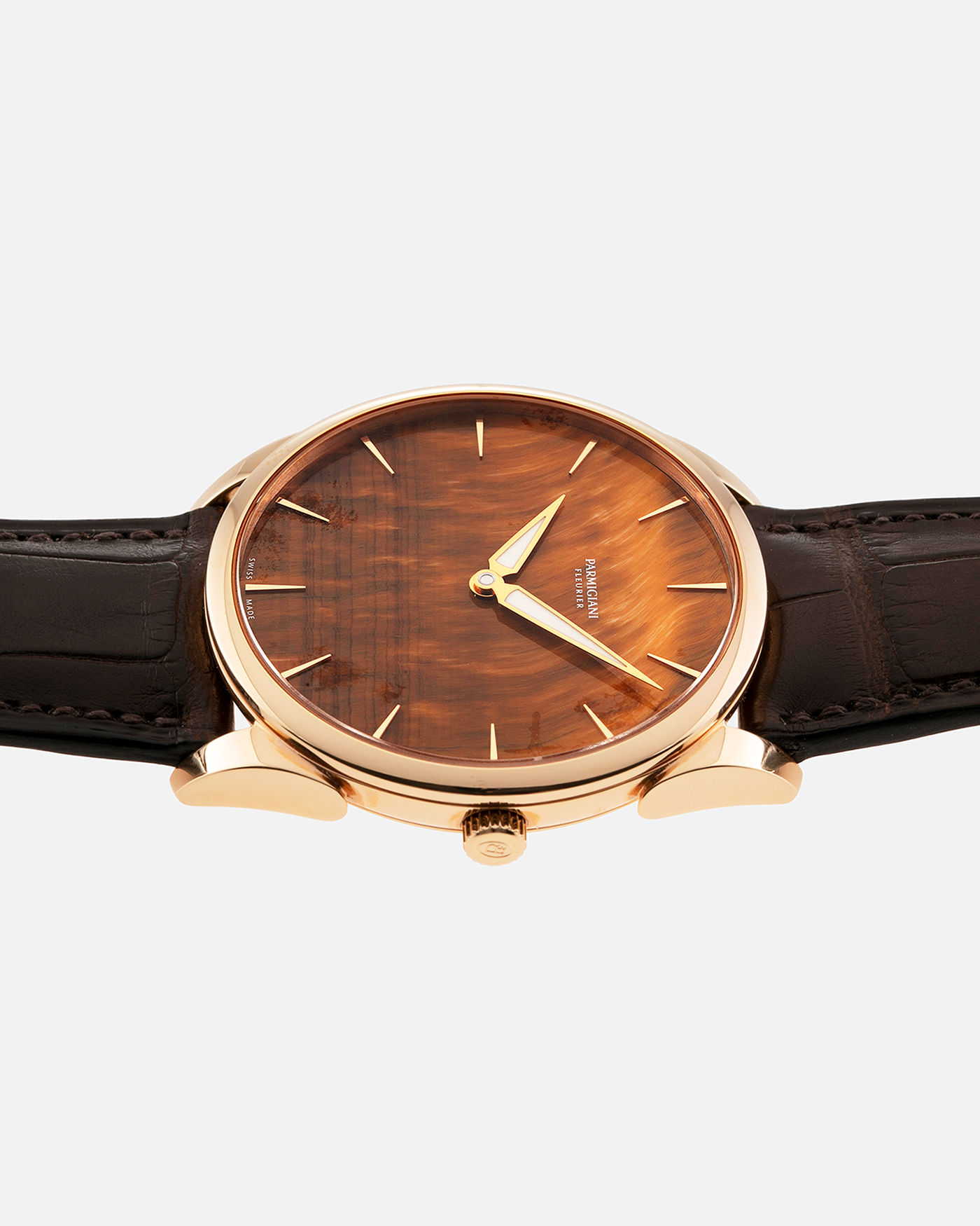 Brand: Parmigiani Fleurier Year: 2022 Model: Tonda 1950 Pisa Edition Tiger Eye Material: 18k Rose Gold Movement: In-House PF 701 Micro Rotor Case Diameter: 39mm Strap: Parmigiani Dark Brown Alligator with 18k Rose Gold Tang Buckle