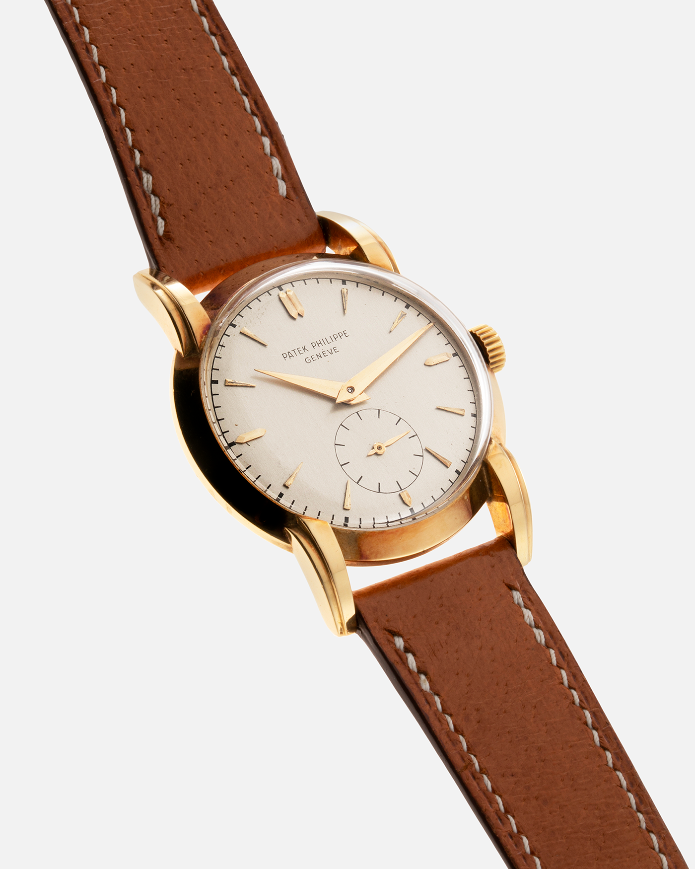 Brand: Patek Philippe Year: 1940 - 1950s Reference Number: 2429 Material: 18-carat Yellow Gold Movement: Cal. 10-200, Manual-Winding Case Diameter: 33mm Bracelet/Strap: Light Brown Nostime Calf Strap with 18k Patek Philippe 18-carat Yellow Gold Tang Buckle
