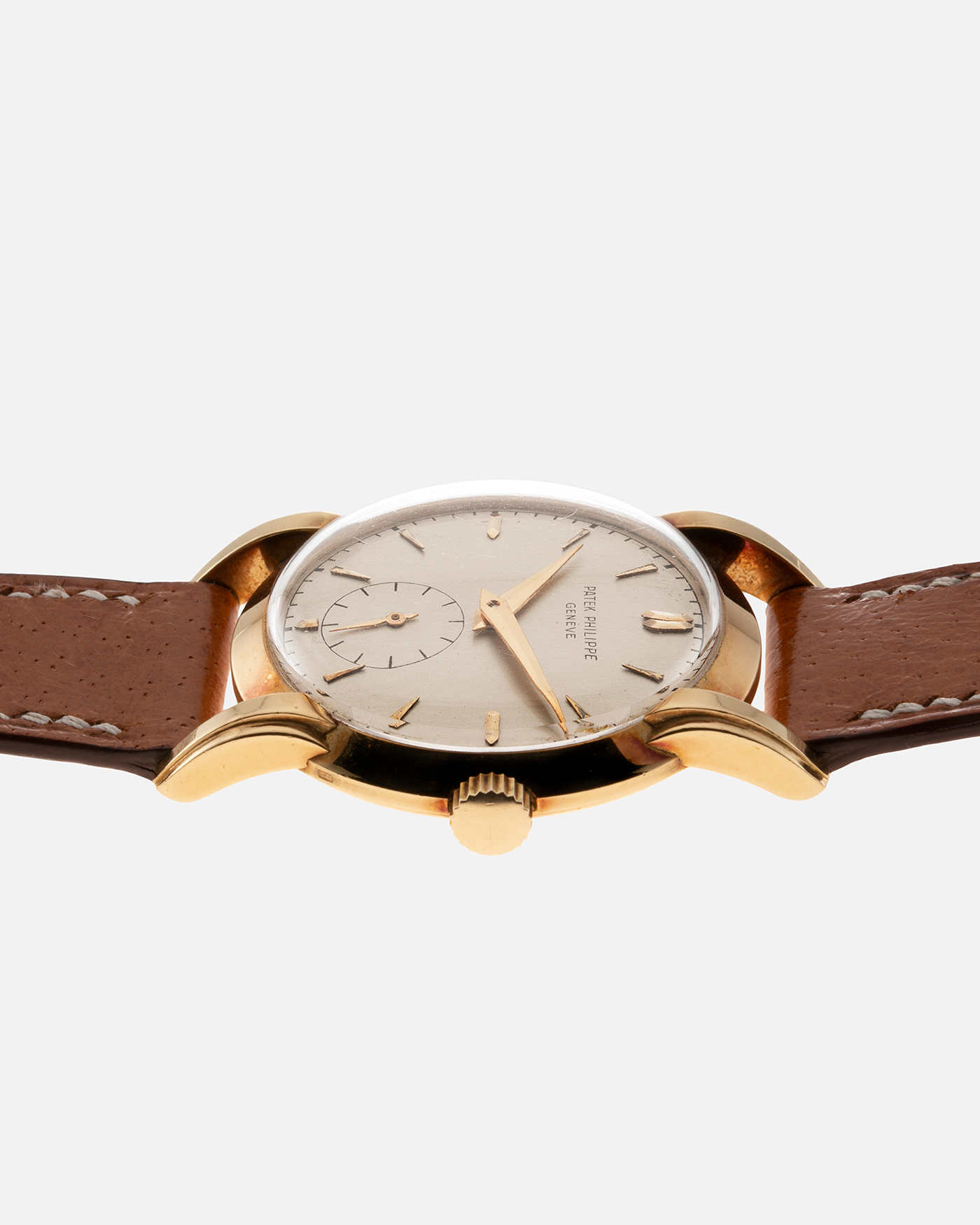 Brand: Patek Philippe Year: 1940 - 1950s Reference Number: 2429 Material: 18-carat Yellow Gold Movement: Cal. 10-200, Manual-Winding Case Diameter: 33mm Bracelet/Strap: Light Brown Nostime Calf Strap with 18k Patek Philippe 18-carat Yellow Gold Tang Buckle