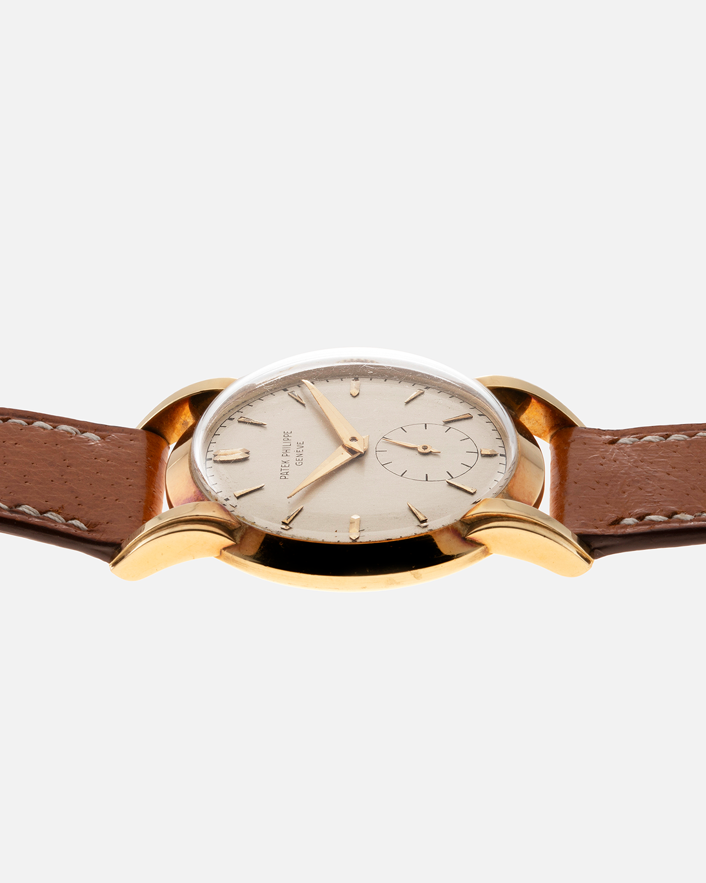 Brand: Patek Philippe Year: 1940 - 1950s Reference Number: 2429 Material: 18-carat Yellow Gold Movement: Cal. 10-200, Manual-Winding Case Diameter: 33mm Bracelet/Strap: Light Brown Nostime Calf Strap with 18k Patek Philippe 18-carat Yellow Gold Tang Buckle