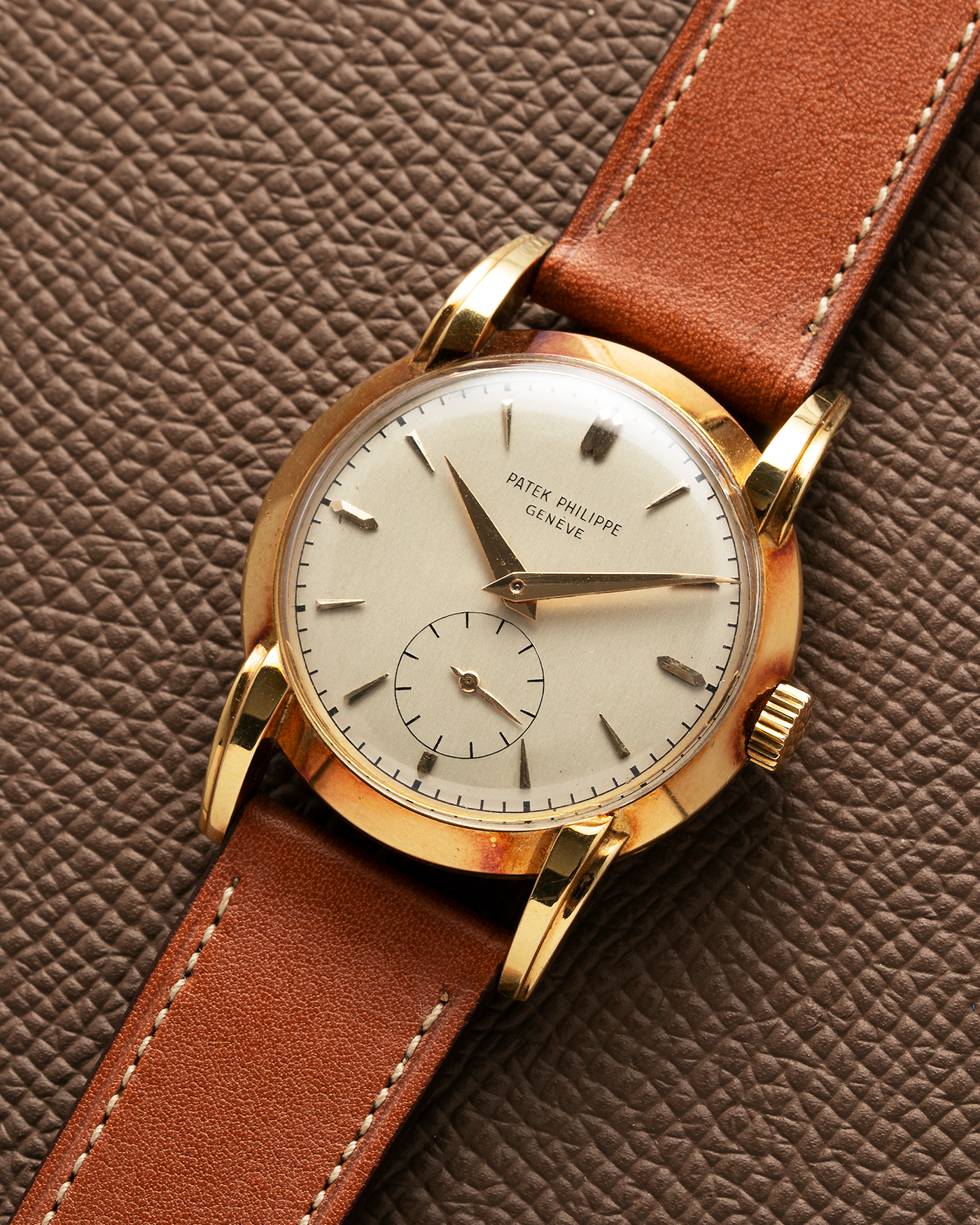 Brand: Patek Philippe Year: 1940 - 1950s Reference Number: 2429 Material: 18-carat Yellow Gold Movement: Cal. 10-200, Manual-Winding Case Diameter: 33mm Bracelet/Strap: Light Brown Nostime Calf Strap with 18k Patek Philippe 18-carat Yellow Gold Tang Buckle