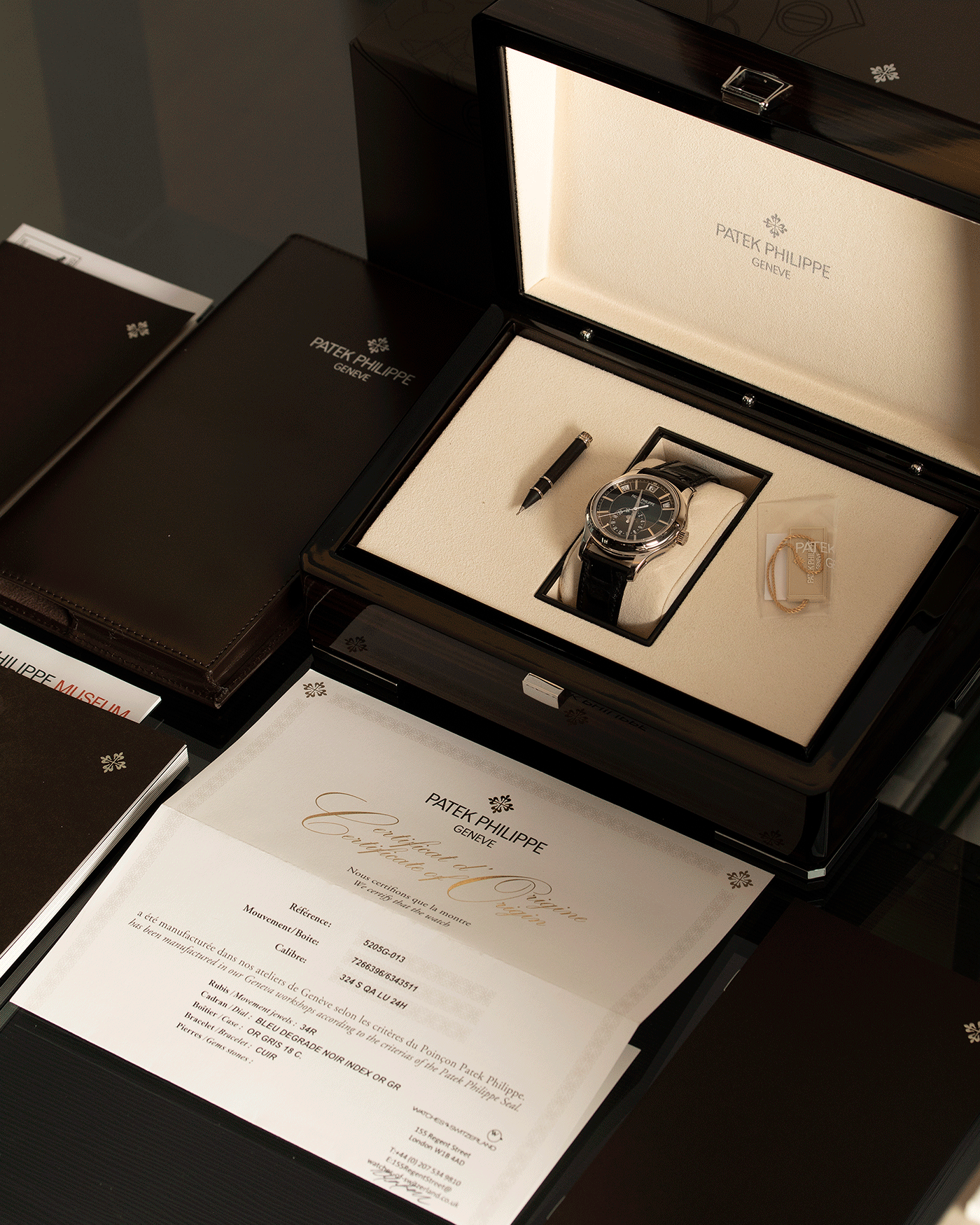 Brand: Patek Philippe Year: 2019 Model: Annual Calendar Reference Number: 5205G Material: 18k White Gold Movement: Cal 324 S QA LU 24H Case Diameter: 40mm Bracelet: Patek Philippe Black Alligator Strap with 18k White Gold Tang Buckle