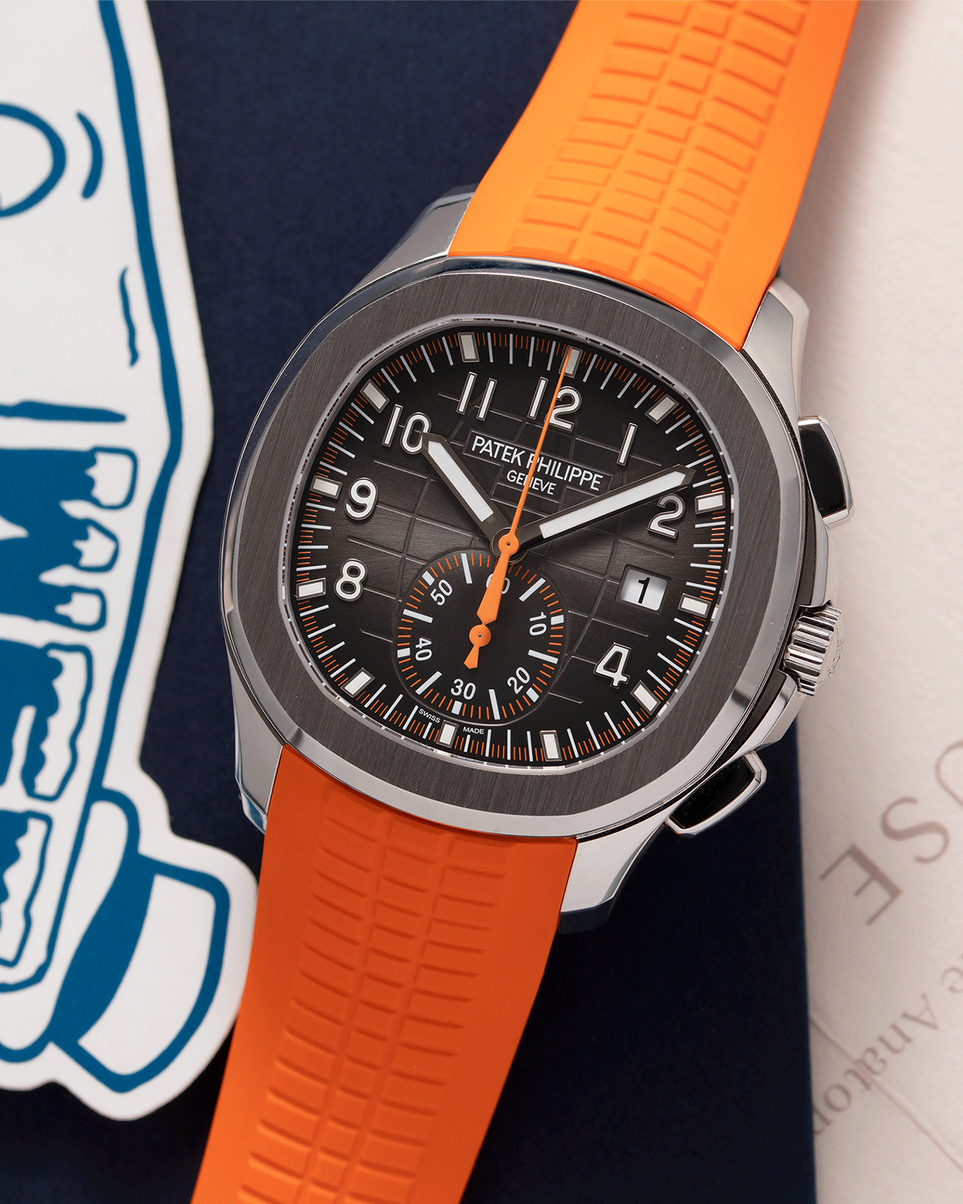 Brand: Patek Philippe Year: 2019 Model: Aquanaut Reference Number: 59689A Material: Stainless Steel Movement: Self Winding Patek Philippe Caliber CH 28-250 C Case Diameter: 42mm Strap: Patek Philippe Aquanaut Orange Rubber Strap and Two Additional Uncut Black and Orange Rubber Straps