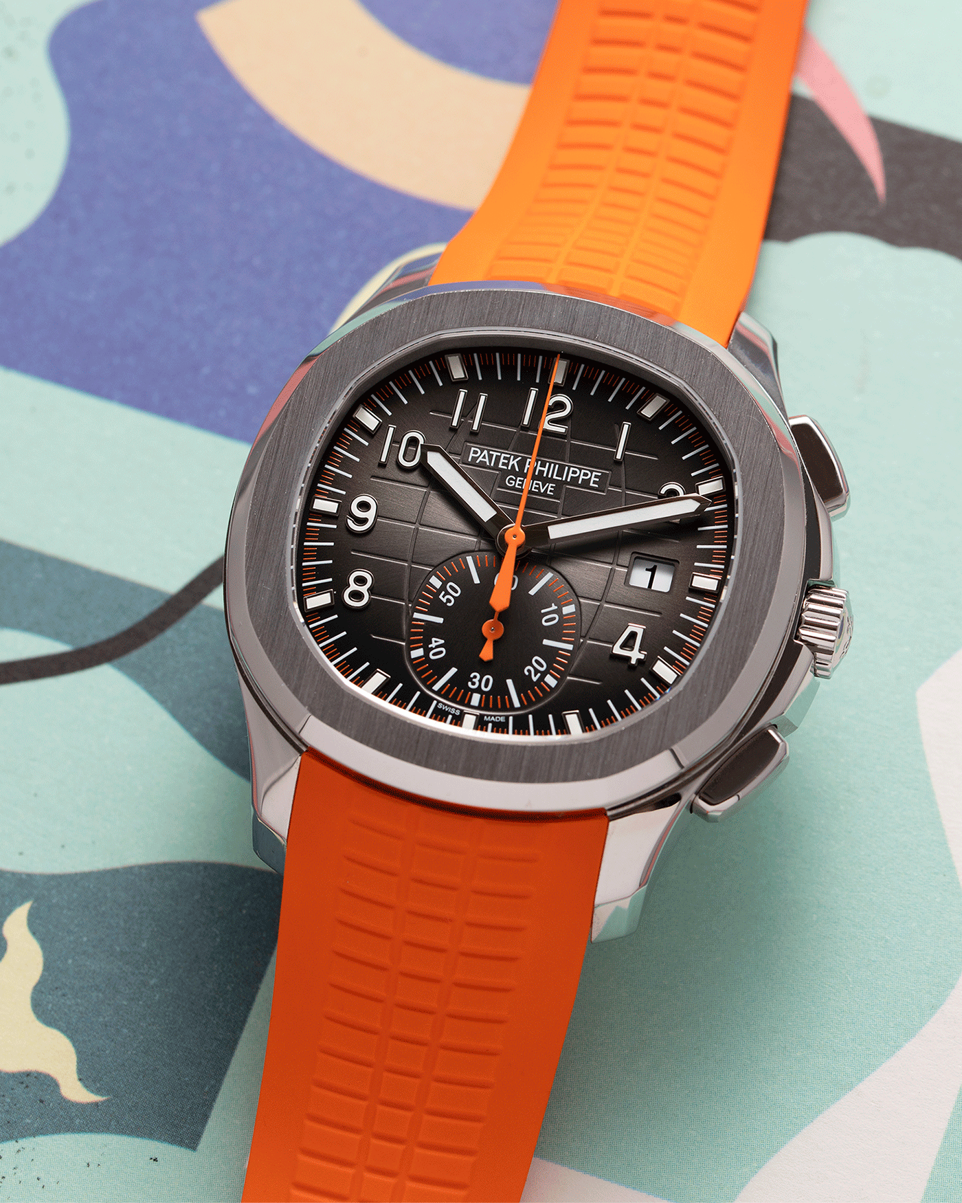 Brand: Patek Philippe Year: 2019 Model: Aquanaut Reference Number: 59689A Material: Stainless Steel Movement: Self Winding Patek Philippe Caliber CH 28-250 C Case Diameter: 42mm Strap: Patek Philippe Aquanaut Orange Rubber Strap and Two Additional Uncut Black and Orange Rubber Straps