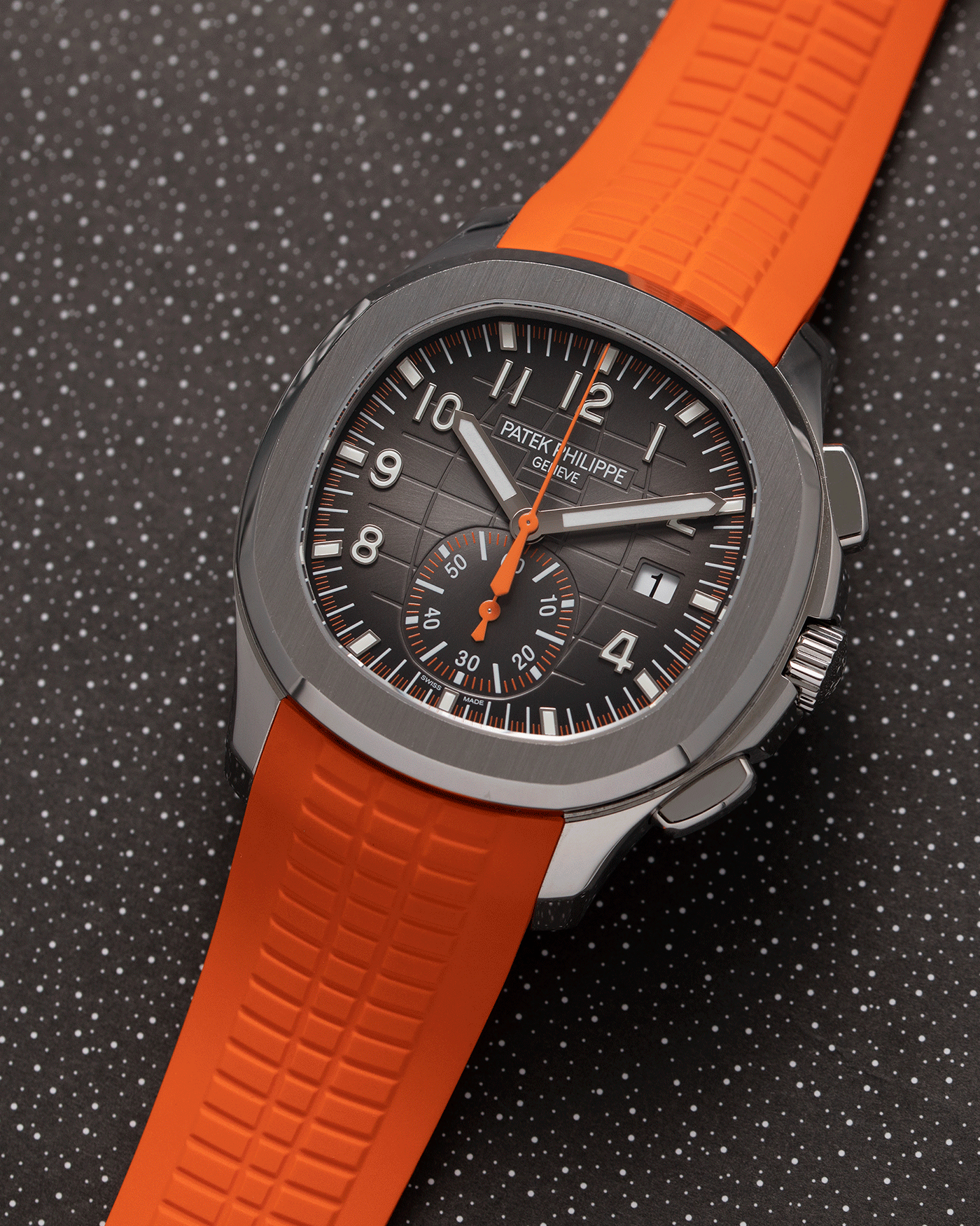 Brand: Patek Philippe Year: 2019 Model: Aquanaut Reference Number: 59689A Material: Stainless Steel Movement: Self Winding Patek Philippe Caliber CH 28-250 C Case Diameter: 42mm Strap: Patek Philippe Aquanaut Orange Rubber Strap and Two Additional Uncut Black and Orange Rubber Straps