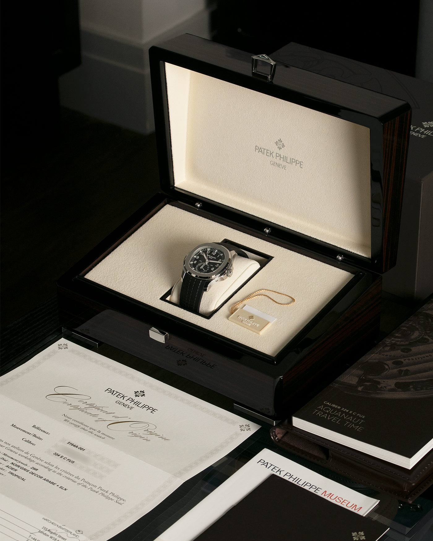 Brand: Patek Philippe Year: 2021 Model: Aquanaut Reference Number: 5164A Material: Stainless Steel Movement: Calibre 324 C FUS Case Diameter: 40.8mm Bracelet: Uncut Patek Philippe Aquanaut Black Tropical Rubber Strap with Signed Deployant Clasp
