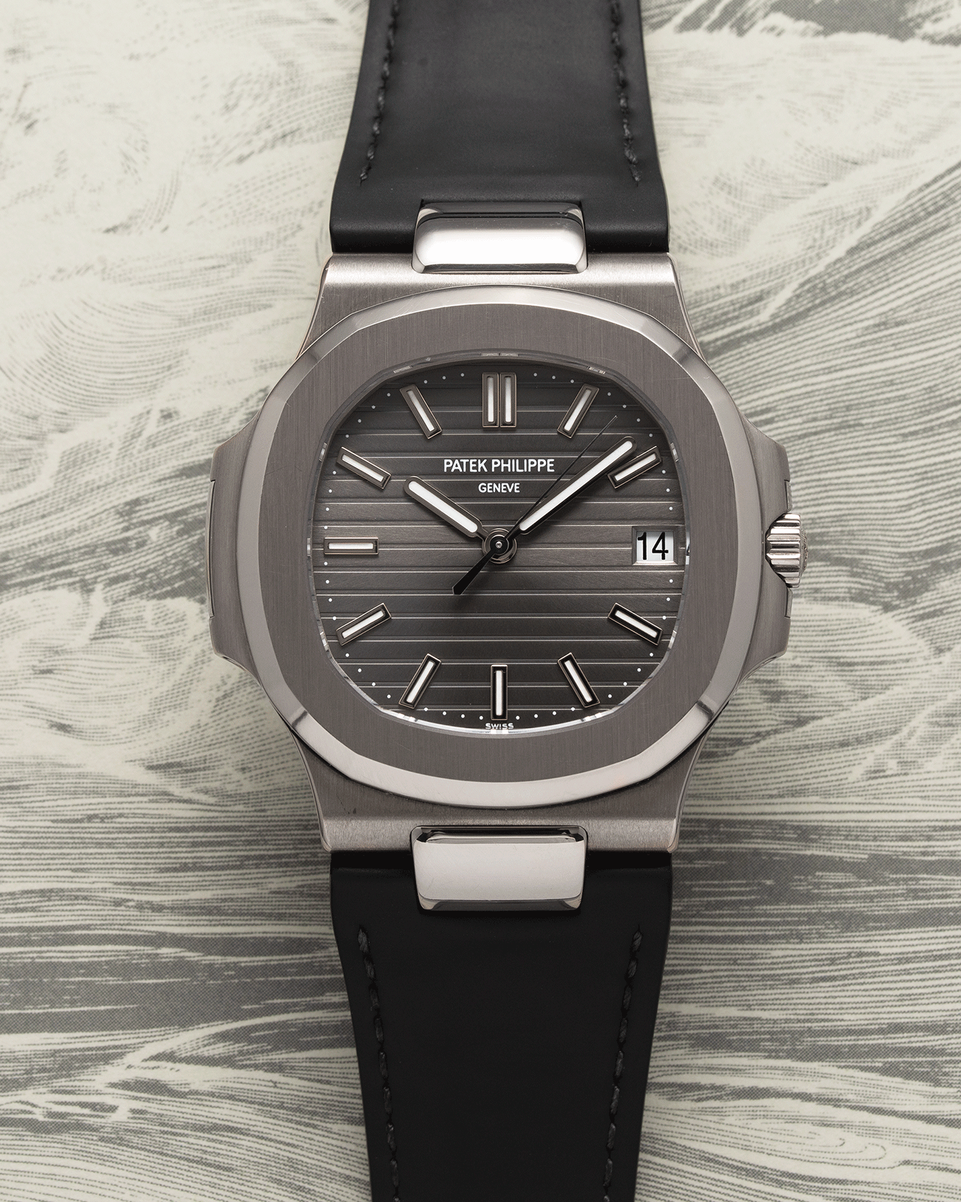 Brand: Patek Philippe Year: 2008 Model: Nautilus Reference Number: 5711G Material:18k White Gold Movement: Calibre 324SC Case Diameter: 40mm Bracelet: Patek Philippe Grey Leather Strap with 18k White Gold Nautilus Deployant