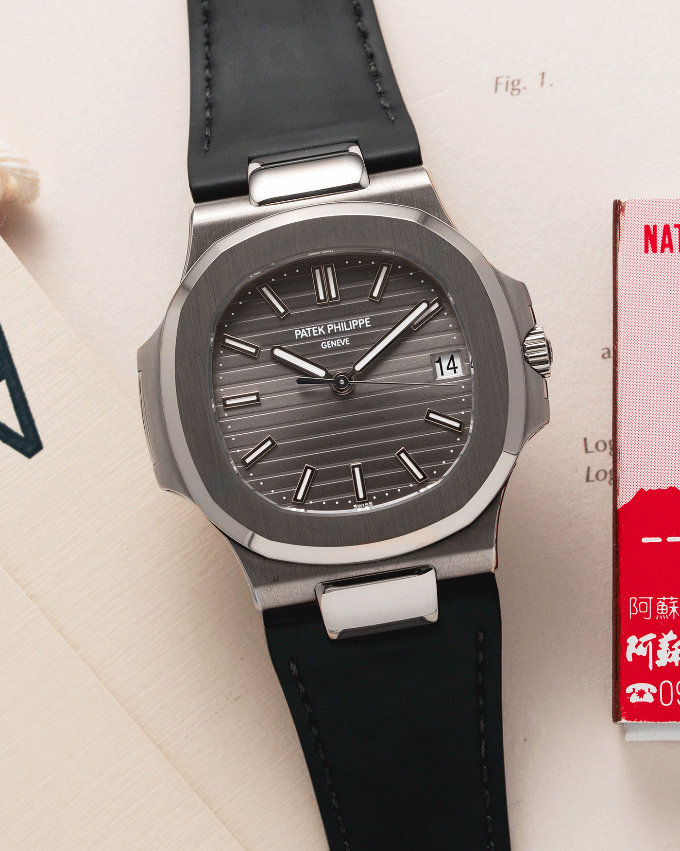 Brand: Patek Philippe Year: 2008 Model: Nautilus Reference Number: 5711G Material:18k White Gold Movement: Calibre 324SC Case Diameter: 40mm Bracelet: Patek Philippe Grey Leather Strap with 18k White Gold Nautilus Deployant