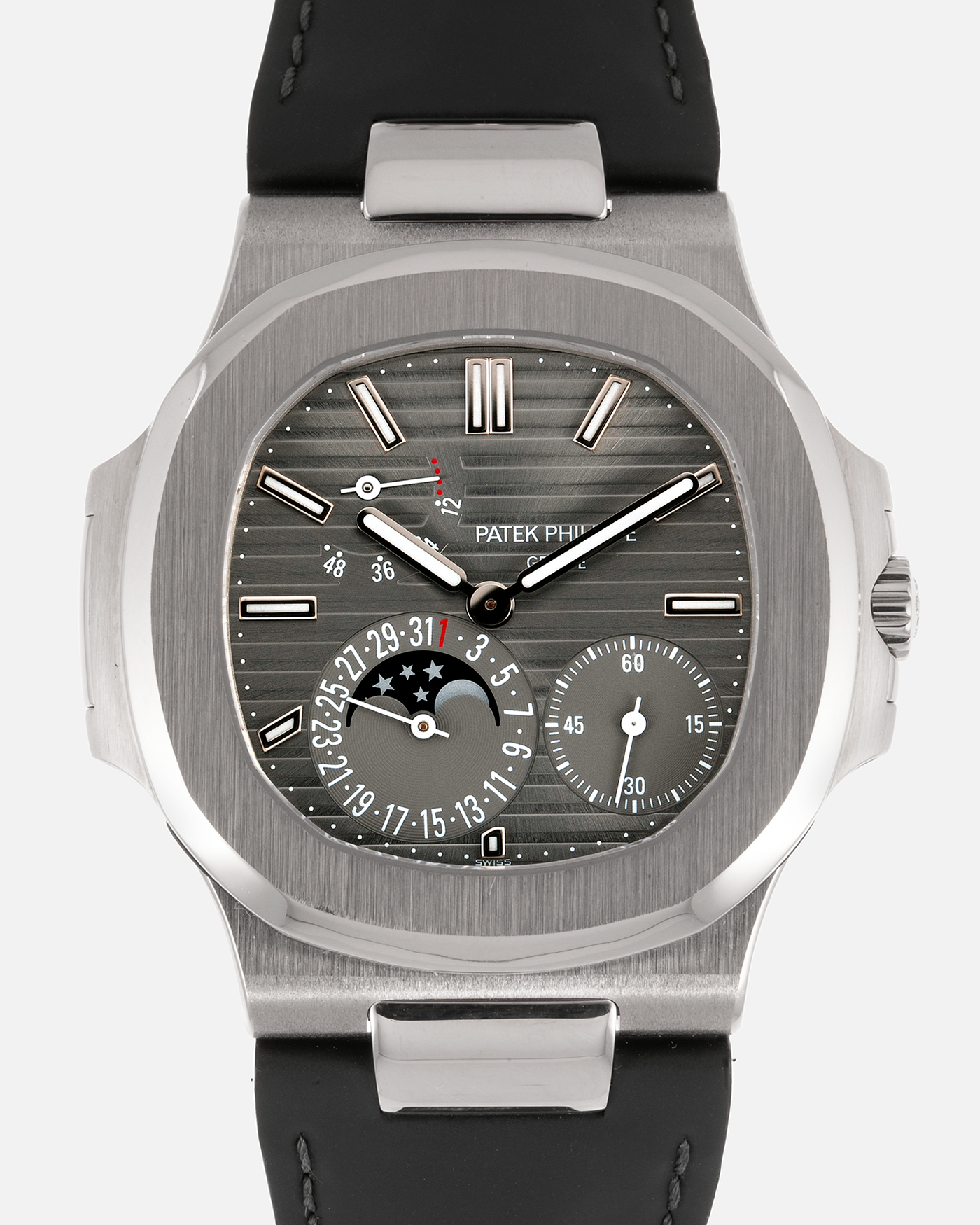 Brand: Patek Philippe Year: 2013 Model: Nautilus Reference Number: 5712G Material:18k White Gold Movement: Cal. 240 PS IRM C LU Case Diameter: 40mm Bracelet: Patek Philippe Grey Leather Strap with 18k White Gold Nautilus Deployant