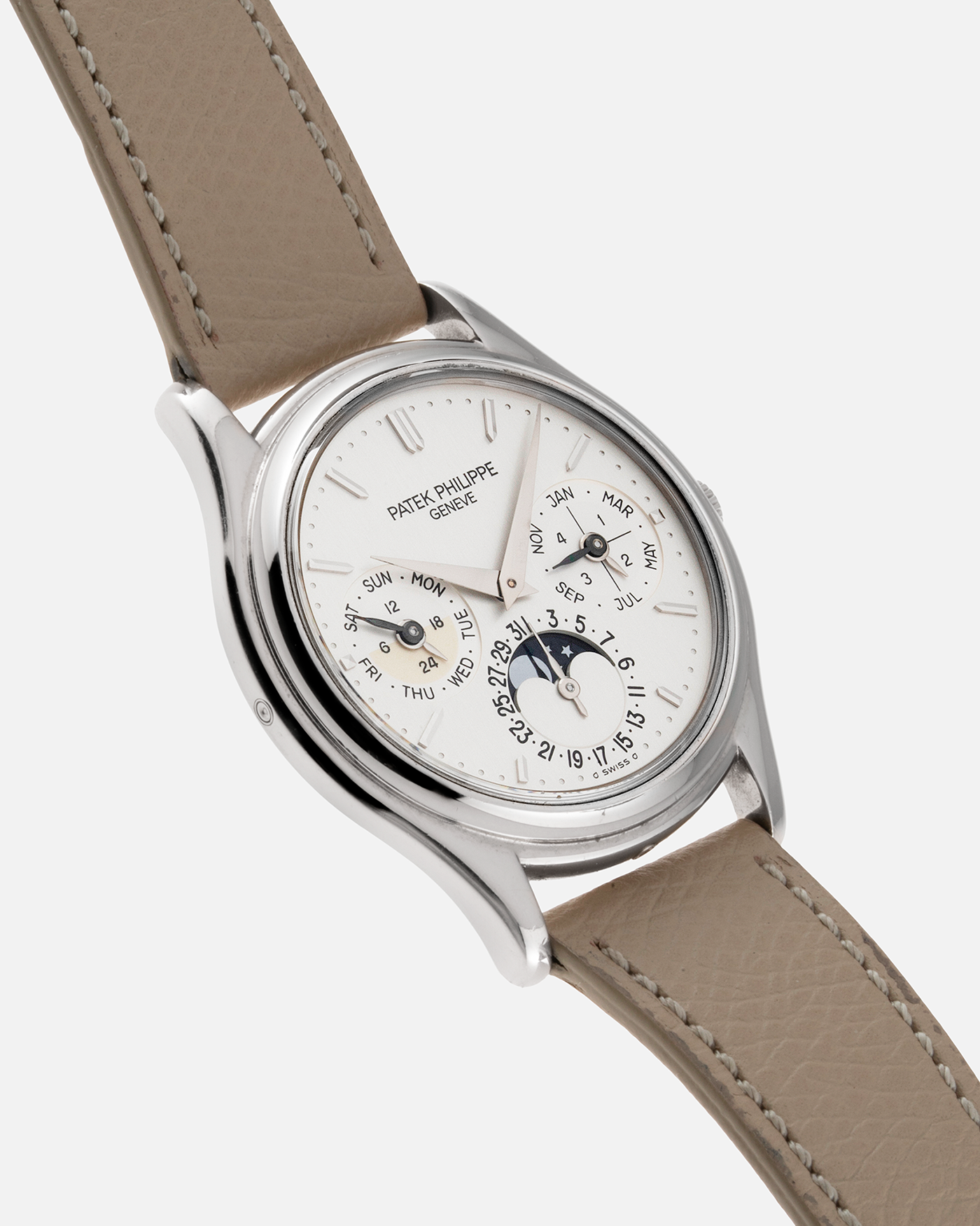 Brand: Patek Philippe Year: 1990’s Model: Perpetual Calendar Reference Number: 3940G Material: 18k White Gold Movement: Cal 240Q Case Diameter: 36mm Bracelet: Taupe Calf Leather Strap and 18k White Gold Patek Philippe Tang Buckle