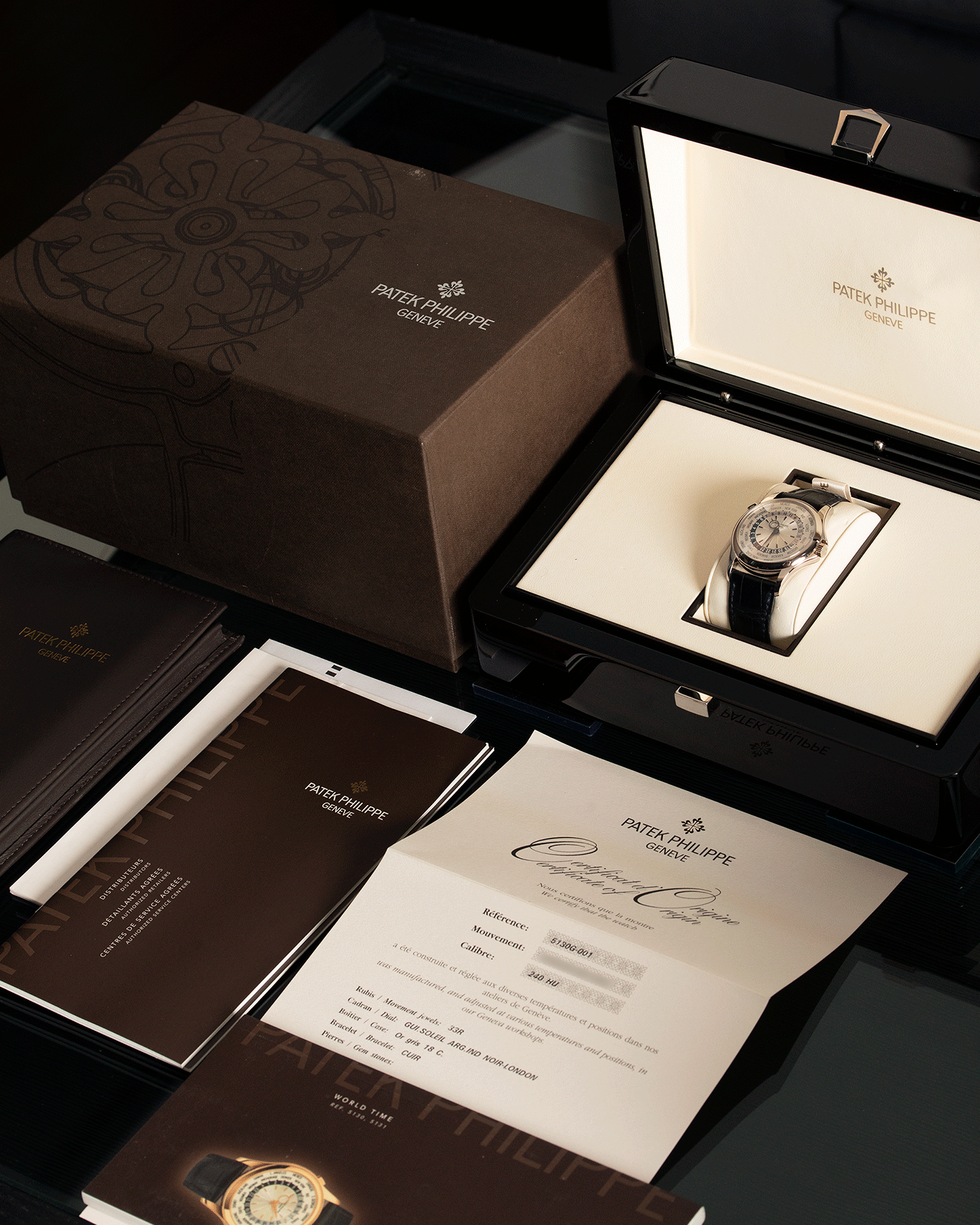 Brand: Patek Philippe Year: 2011 Model: World Time Reference Number: 5130G Material: 18k White Gold Movement: Cal 240 HU Case Diameter: 39.5mm Bracelet: Patek Philippe Black Alligator Strap with 18k White Gold Calatrava Deployant Clasp