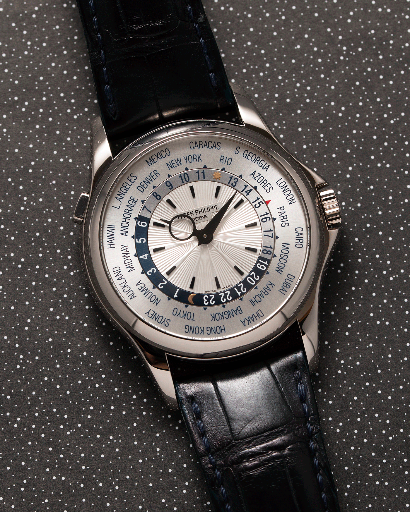 Brand: Patek Philippe Year: 2011 Model: World Time Reference Number: 5130G Material: 18k White Gold Movement: Cal 240 HU Case Diameter: 39.5mm Bracelet: Patek Philippe Black Alligator Strap with 18k White Gold Calatrava Deployant Clasp