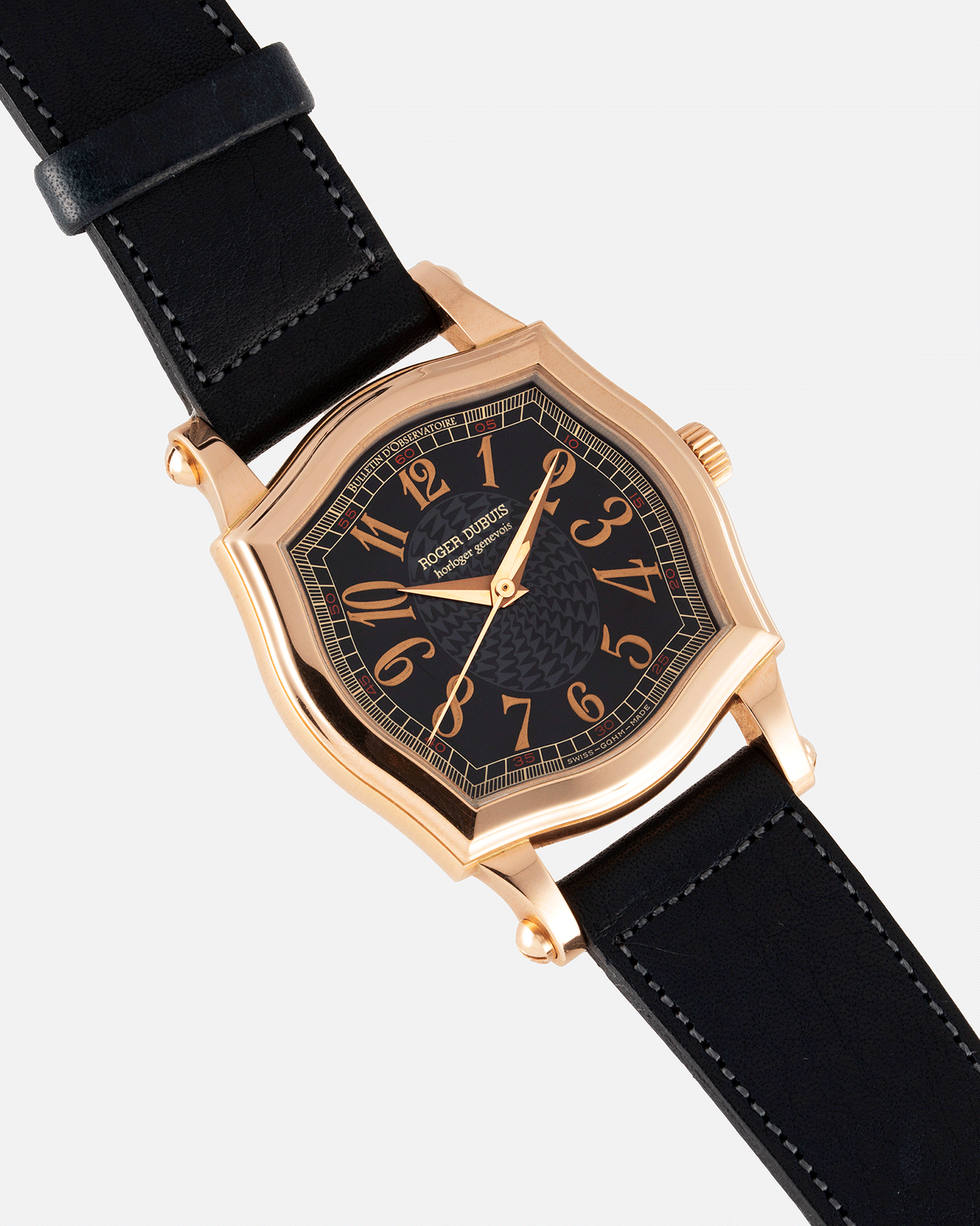 Brand: Roger Dubuis Year: 1998 Model: Sympathie 34 Material: 18k Rose Gold Movement: Cal RD 57 Case Diameter: 34mm Strap: Navy Blue Accurate Form Japanese Calf Leather and 18k Rose Gold Roger Dubuis Tang Buckle