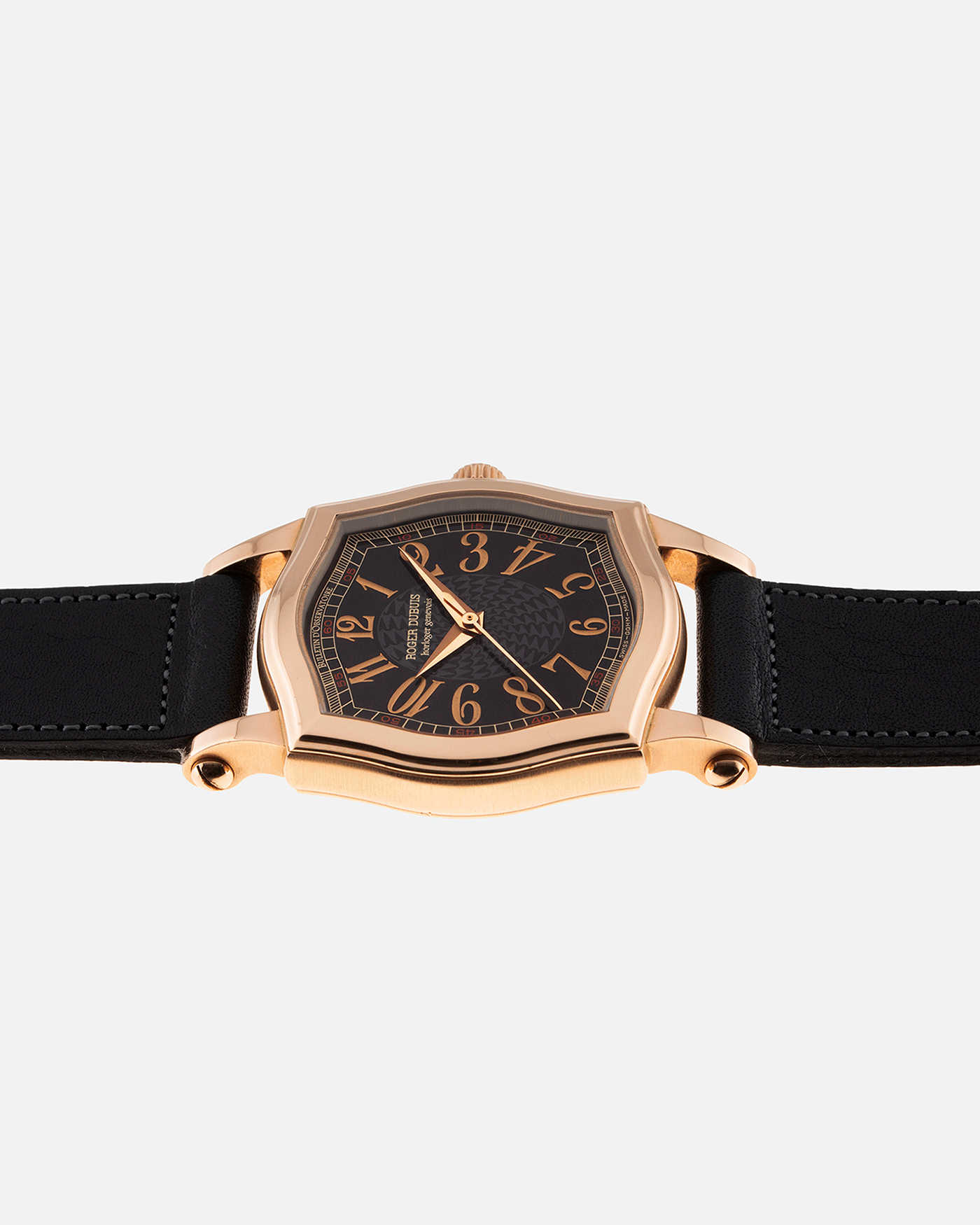 Brand: Roger Dubuis Year: 1998 Model: Sympathie 34 Material: 18k Rose Gold Movement: Cal RD 57 Case Diameter: 34mm Strap: Navy Blue Accurate Form Japanese Calf Leather and 18k Rose Gold Roger Dubuis Tang Buckle