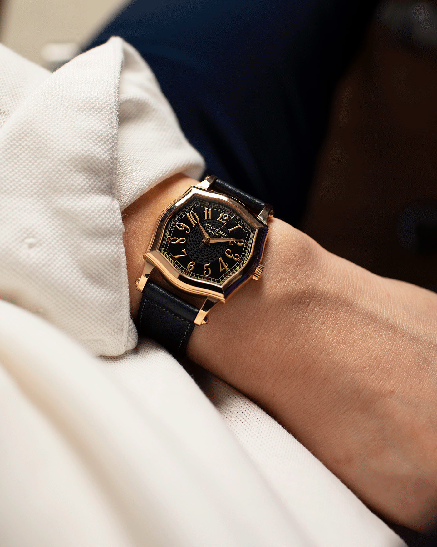 Brand: Roger Dubuis Year: 1998 Model: Sympathie 34 Material: 18k Rose Gold Movement: Cal RD 57 Case Diameter: 34mm Strap: Navy Blue Accurate Form Japanese Calf Leather and 18k Rose Gold Roger Dubuis Tang Buckle