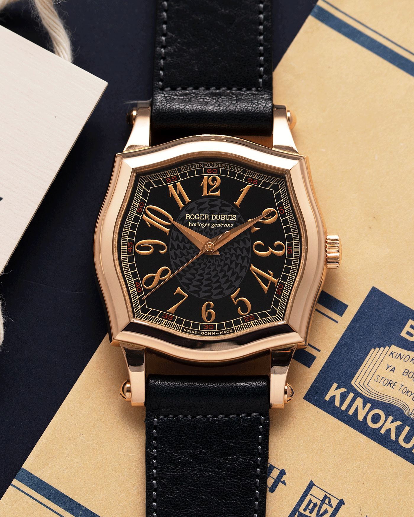 Brand: Roger Dubuis Year: 1998 Model: Sympathie 34 Material: 18k Rose Gold Movement: Cal RD 57 Case Diameter: 34mm Strap: Navy Blue Accurate Form Japanese Calf Leather and 18k Rose Gold Roger Dubuis Tang Buckle