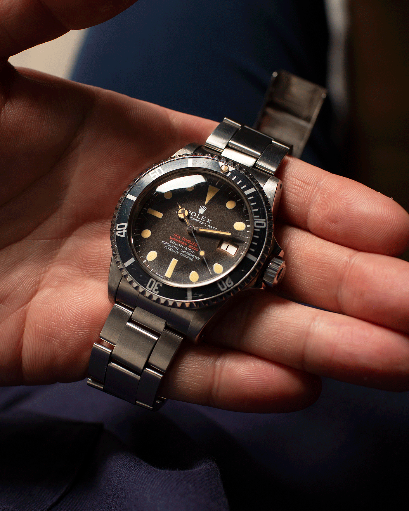 Brand: Rolex Year: 1973 Model: Sea Dweller Reference Number: 1665 Serial Number: 3.7 Mil Material: Stainless Steel Movement: Cal. 1570 Case Diameter: 40mm Lug Width: 20mm Bracelet/Strap: Rolex Pateted 9315 Folded Bracelet with 585 Endlinks 