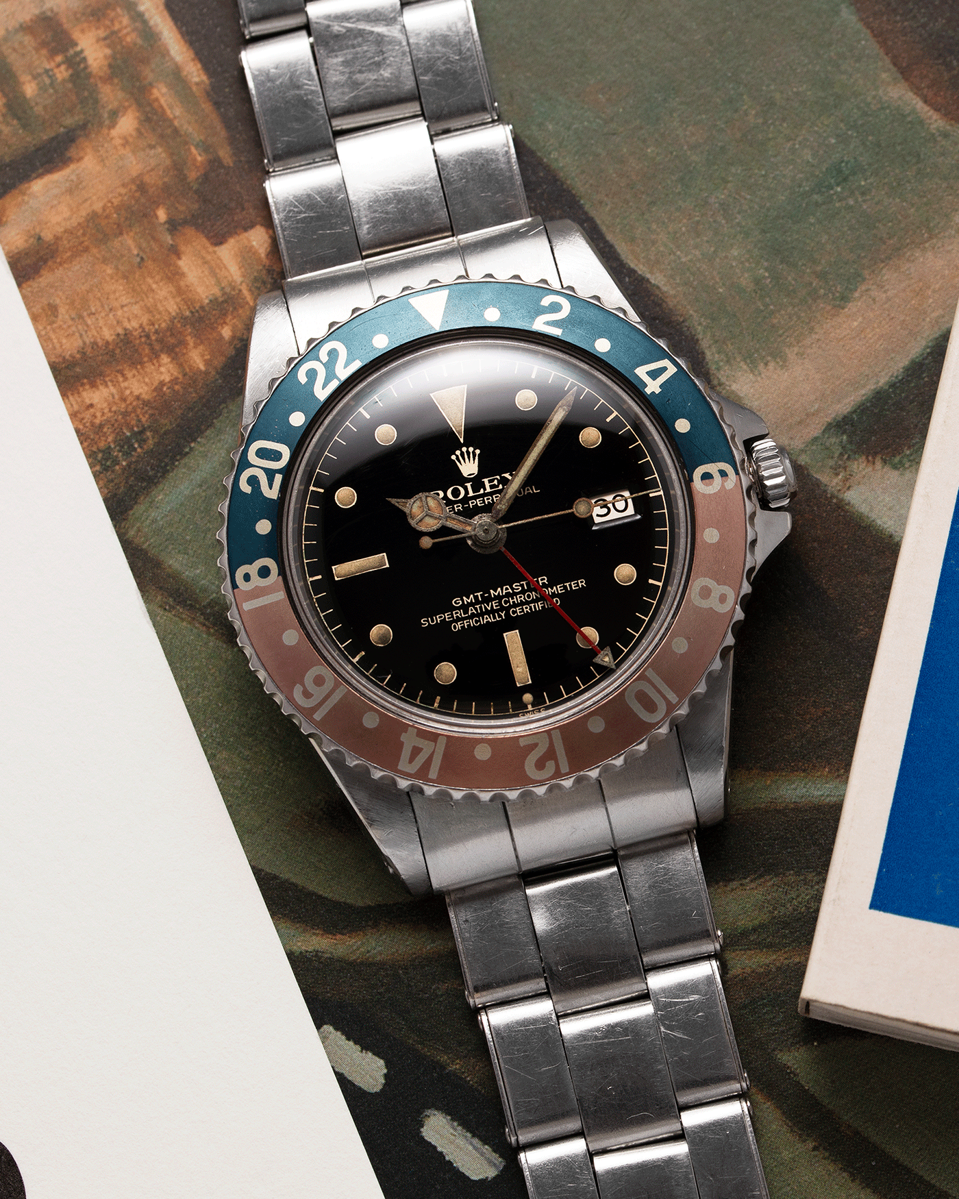 Brand: Rolex Year: 1963 Model: GMT-Master Reference Number: 1675 Serial Number: 87XXXX Material: Stainless Steel Movement: Cal. 1565 Case Diameter: 40mm Lug Width: 20mm Bracelet/Strap: Stainless Steel Rolex C&I Riveted Elastic Bracelet