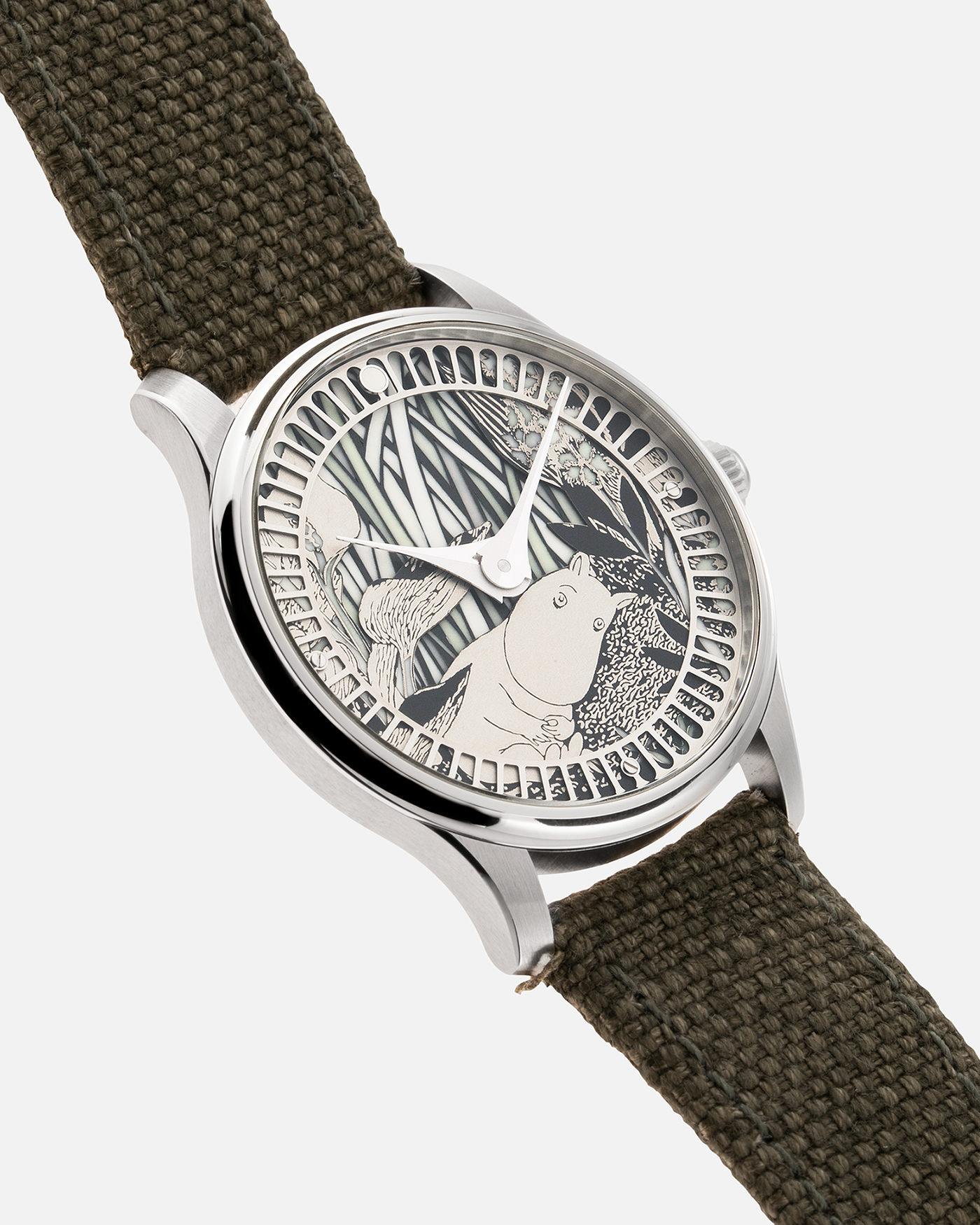 Brand: Sarpaneva S.U.F. Year: 2020 Model: Moomin Material: Stainless Steel Movement: Soprod A10 Case Diameter: 38.7mm Bracelet/Strap: Sarpaneva S.U.F. Green Textile Strap