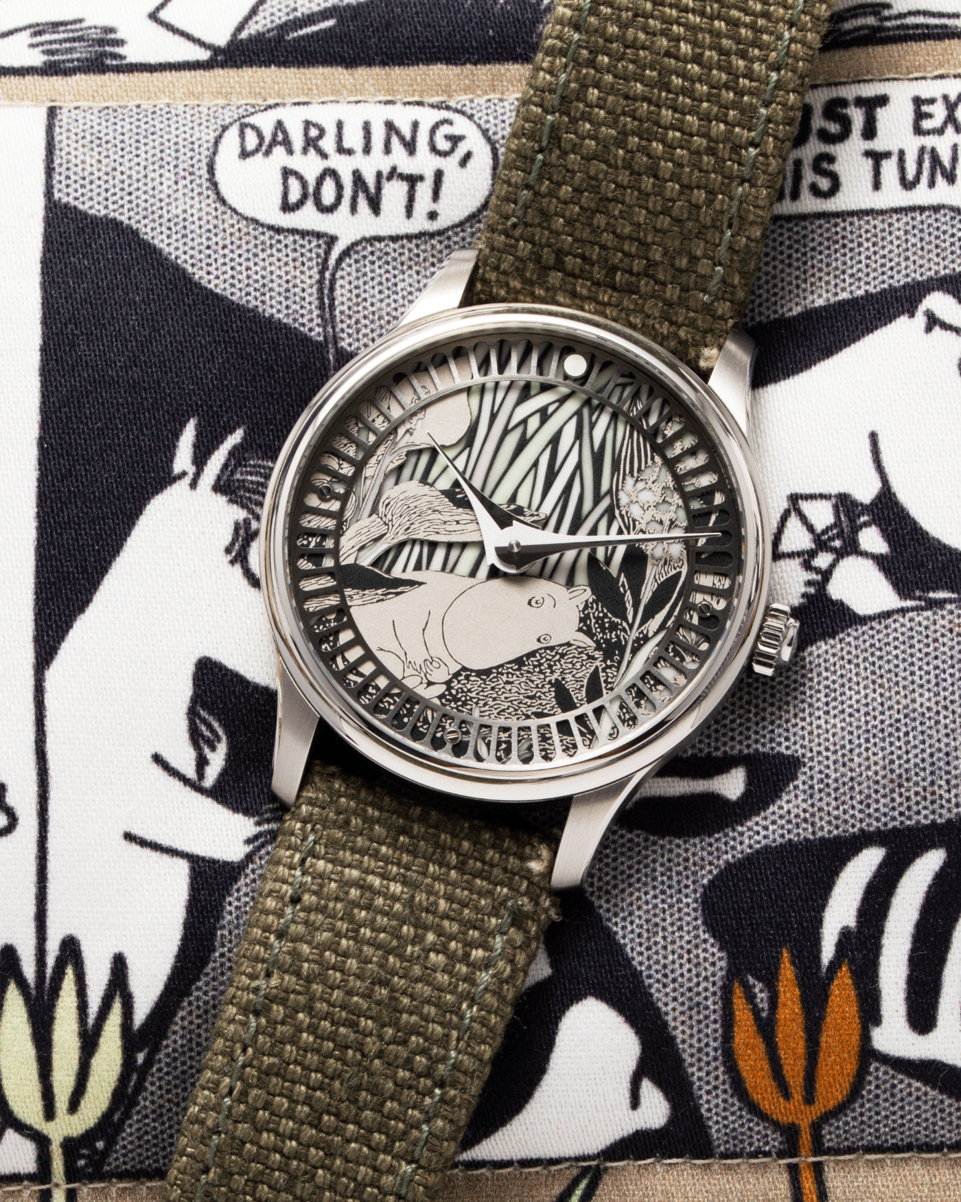 Brand: Sarpaneva S.U.F. Year: 2020 Model: Moomin Material: Stainless Steel Movement: Soprod A10 Case Diameter: 38.7mm Bracelet/Strap: Sarpaneva S.U.F. Green Textile Strap